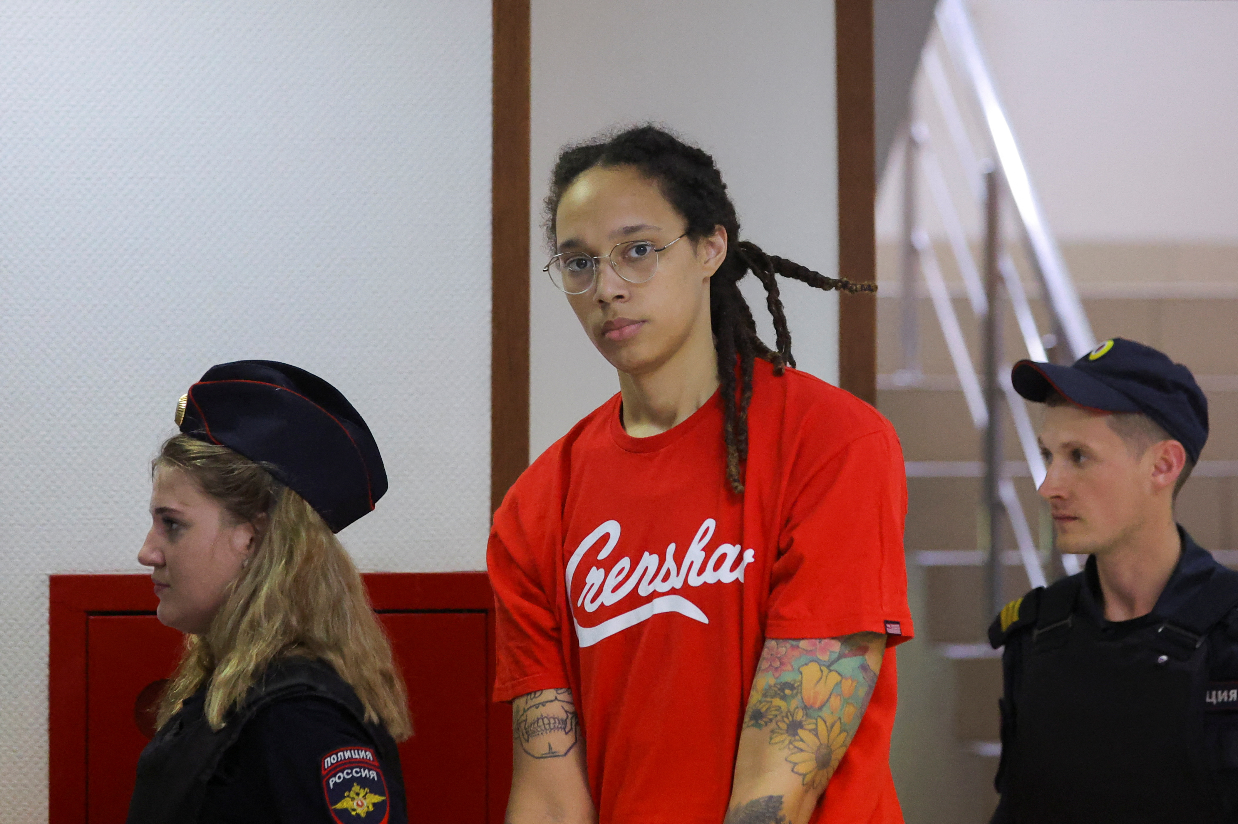 US basketball player Brittney Griner is escorted before a court hearing in Khimki, outside Moscow, Russia