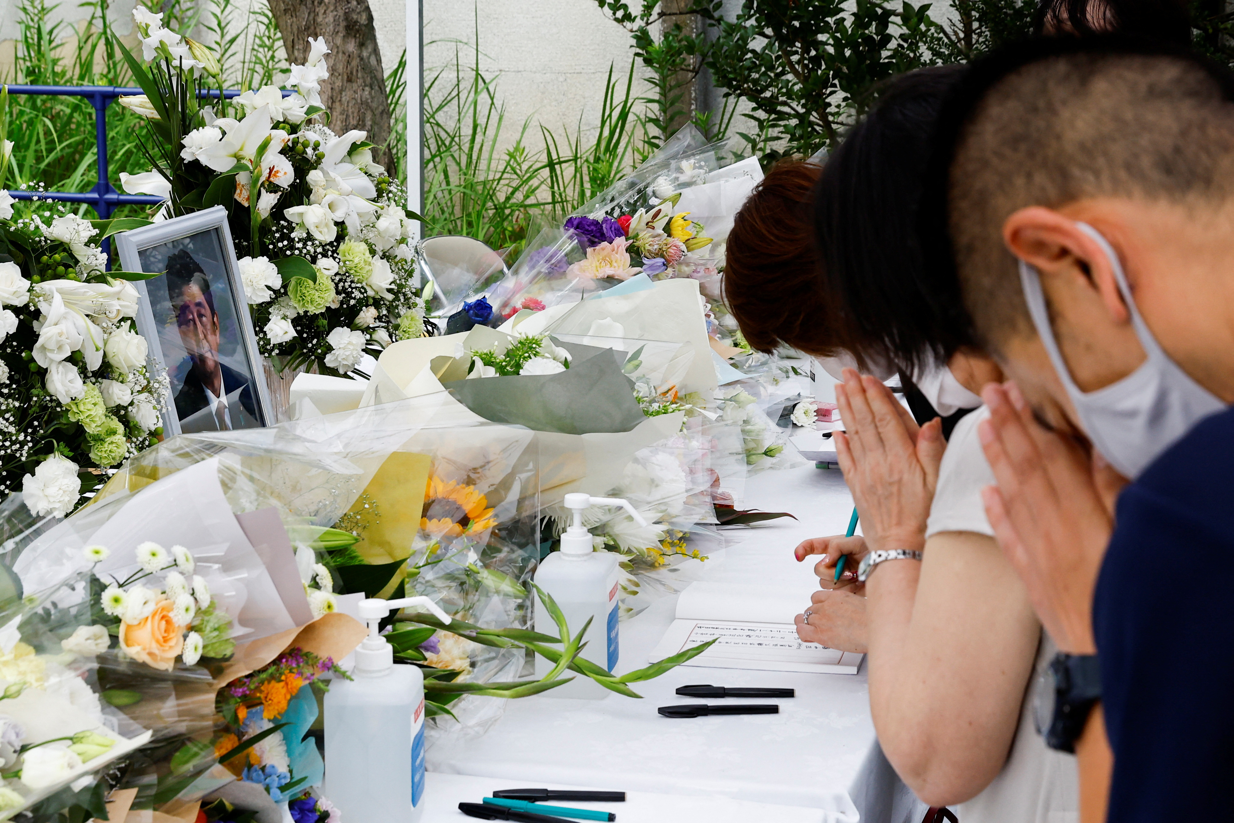 Mourners pray for Abe at the headquarters of the Liberal Democratic Party in Tokyo. He was shot by a man with a homemade gun during a campaign event on Friday