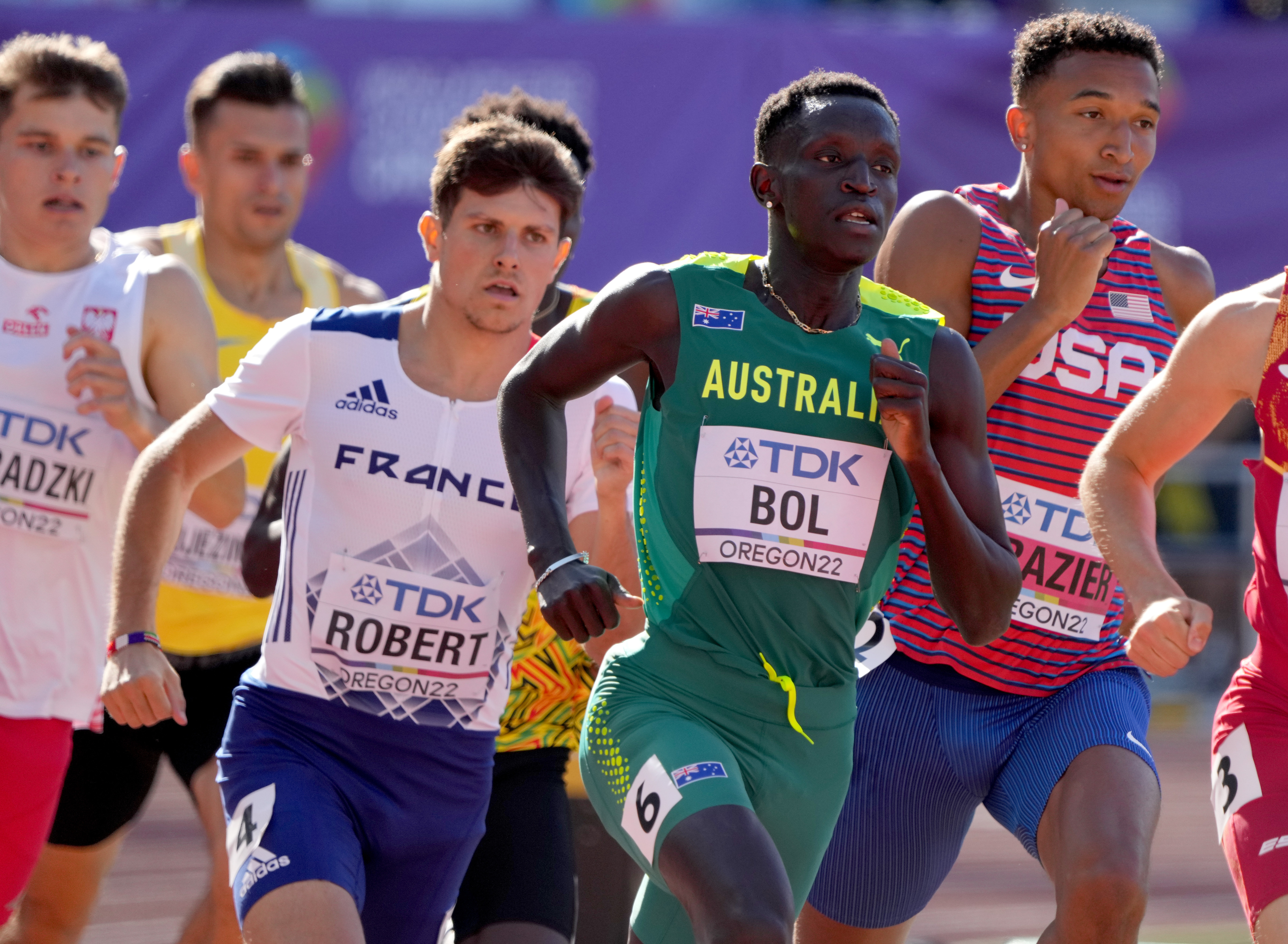 Peter Bol, in the green and gold colours of Australia, runs in the World Athletics Championships.