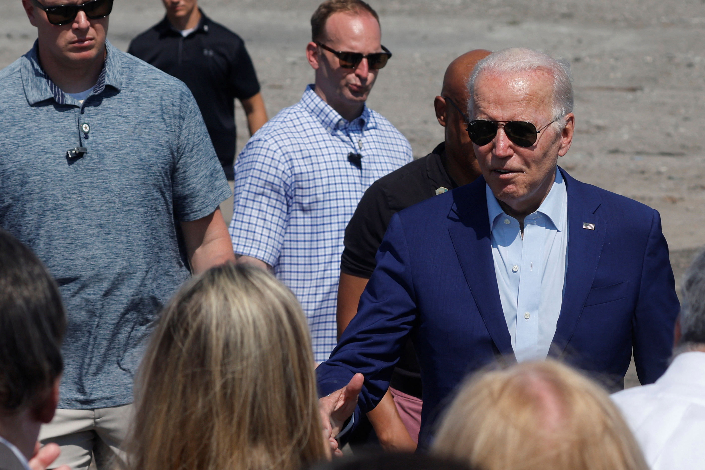 President Joe Biden speaks to people after delivering remarks on climate change