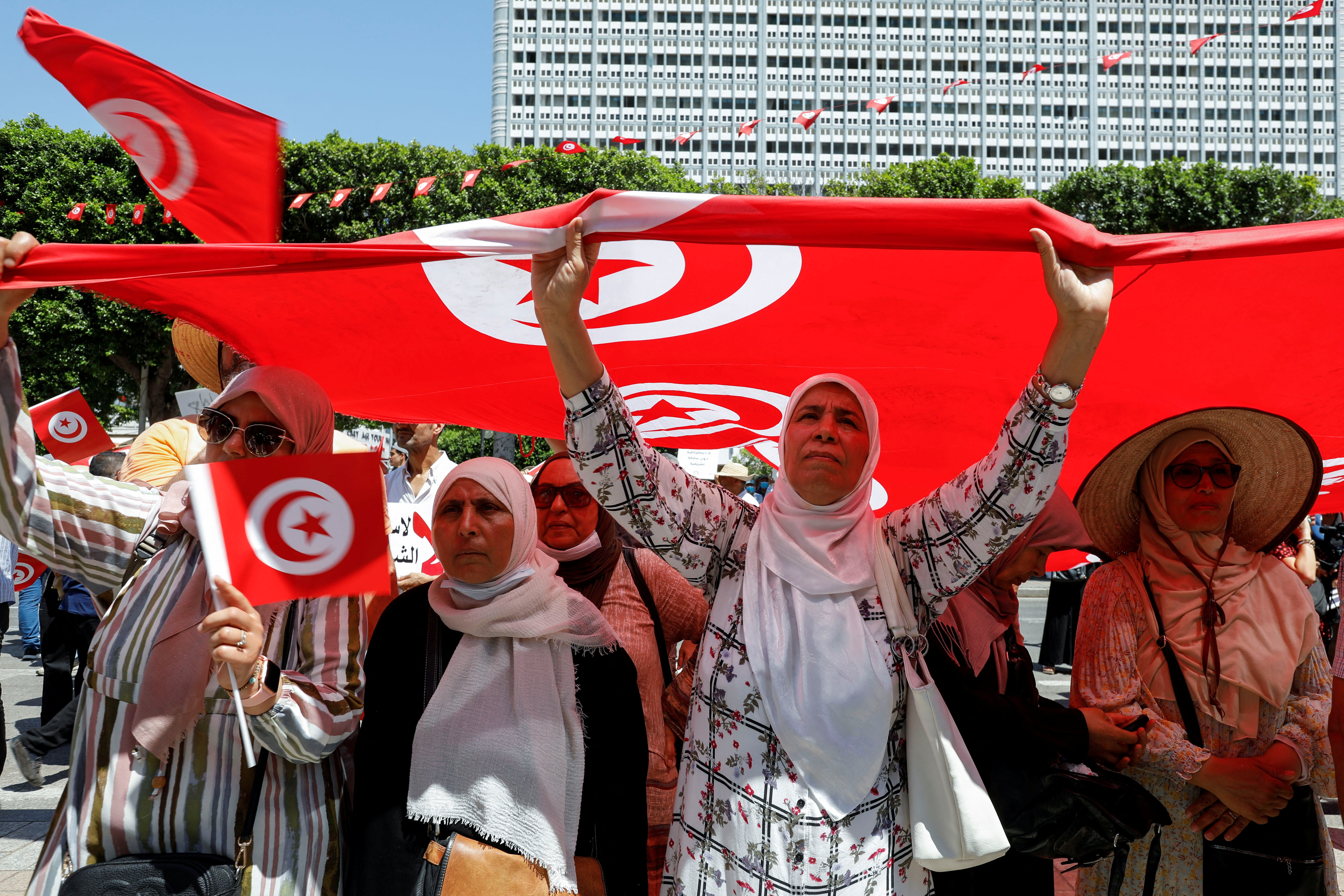 People take part in a protest against President Kais Saied’s draft constitution ahead of a referendum