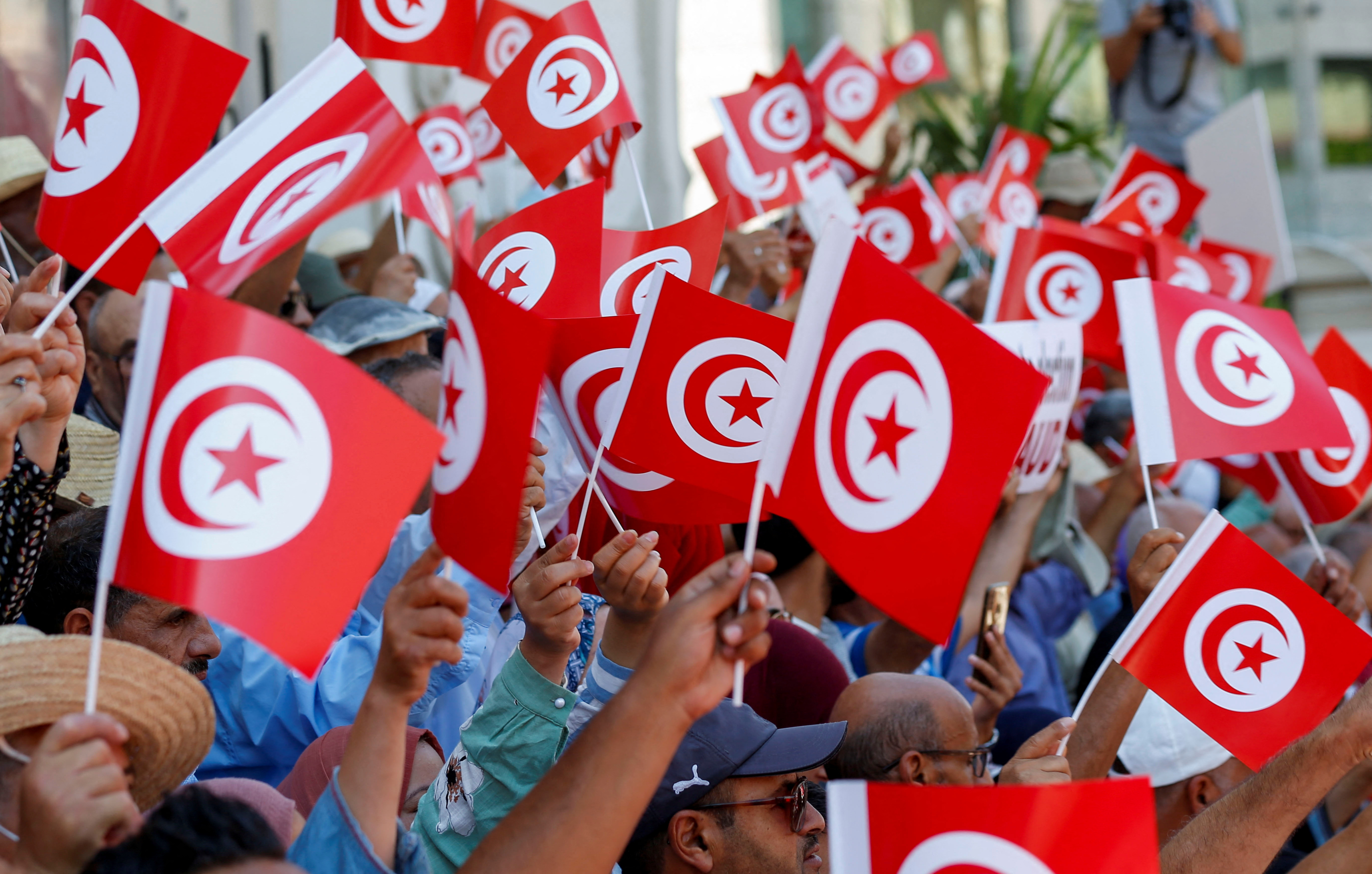 People take part in a protest against President Kais Saied's referendum on a new constitution