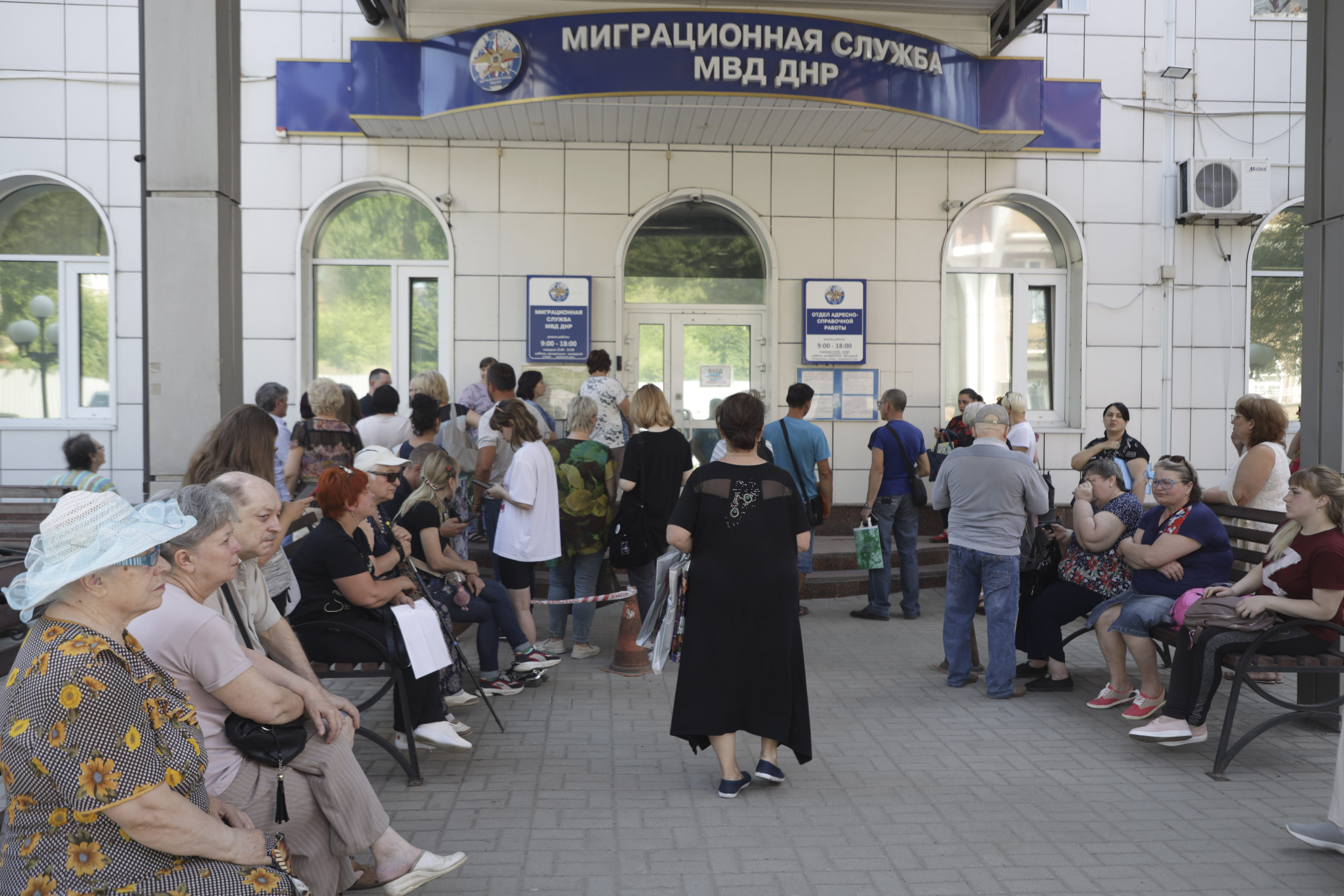 Residents of Donetsk stand in line at a Migration Service office to receive a passport of a citizen of the Russian Federation, in Donetsk, in an area controlled by Russian-backed separatist forces, eastern Ukraine [AP Photo]