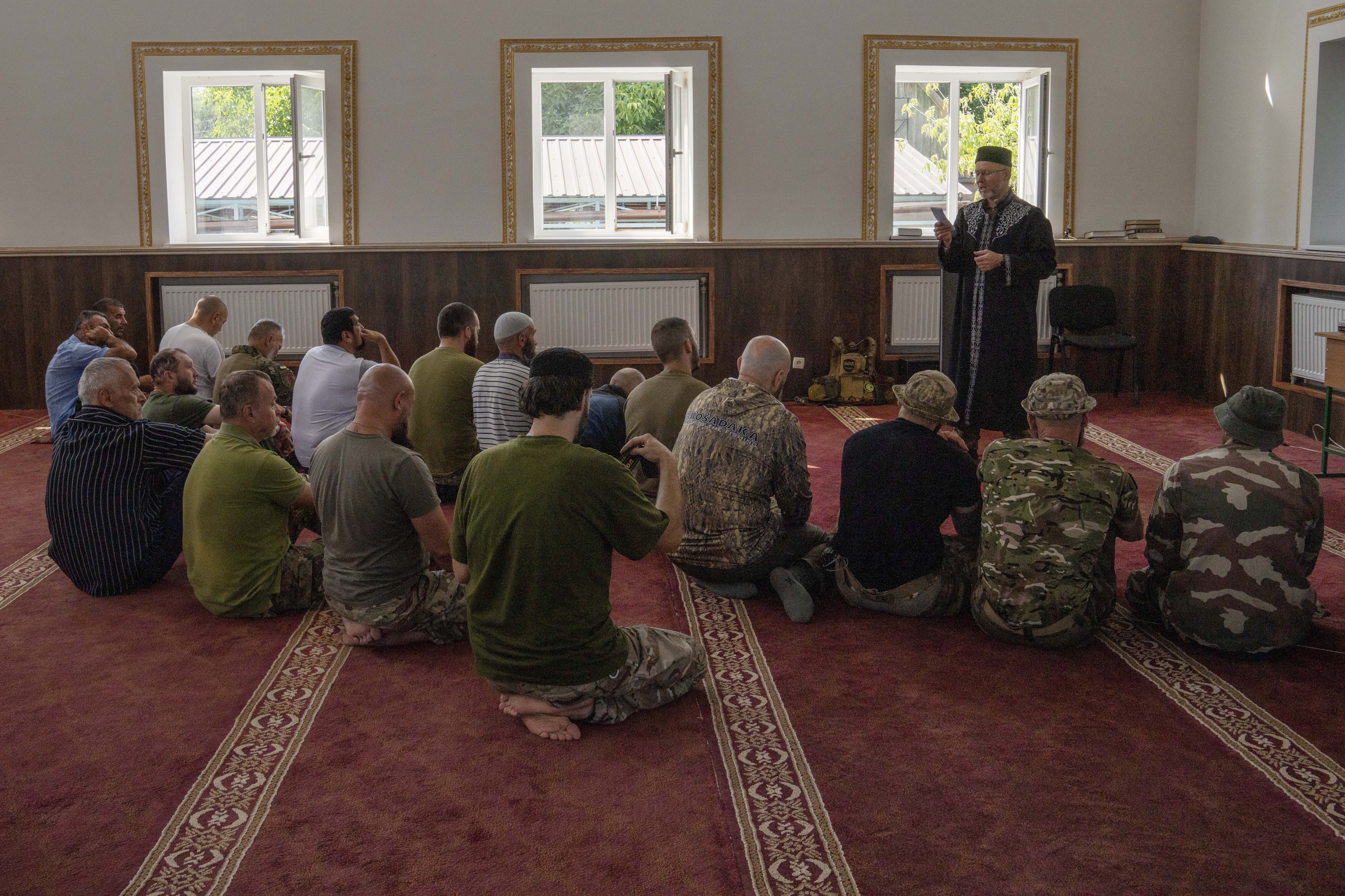Sheikh Said Ismahilov leads Muslim soldiers during prayers at Medina Mosque in Kostiantynivka