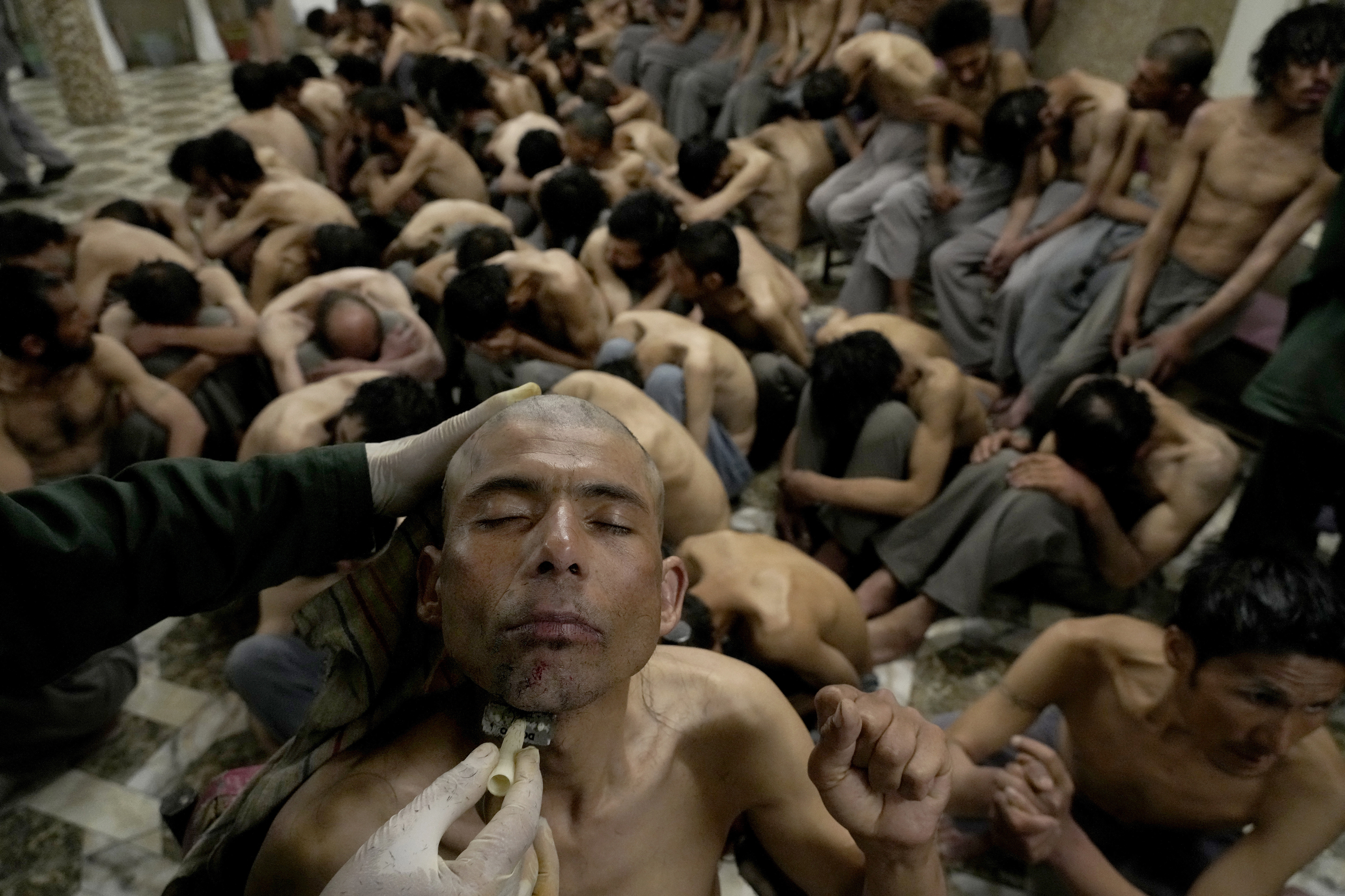 Drug addictS detained during a Taliban raid