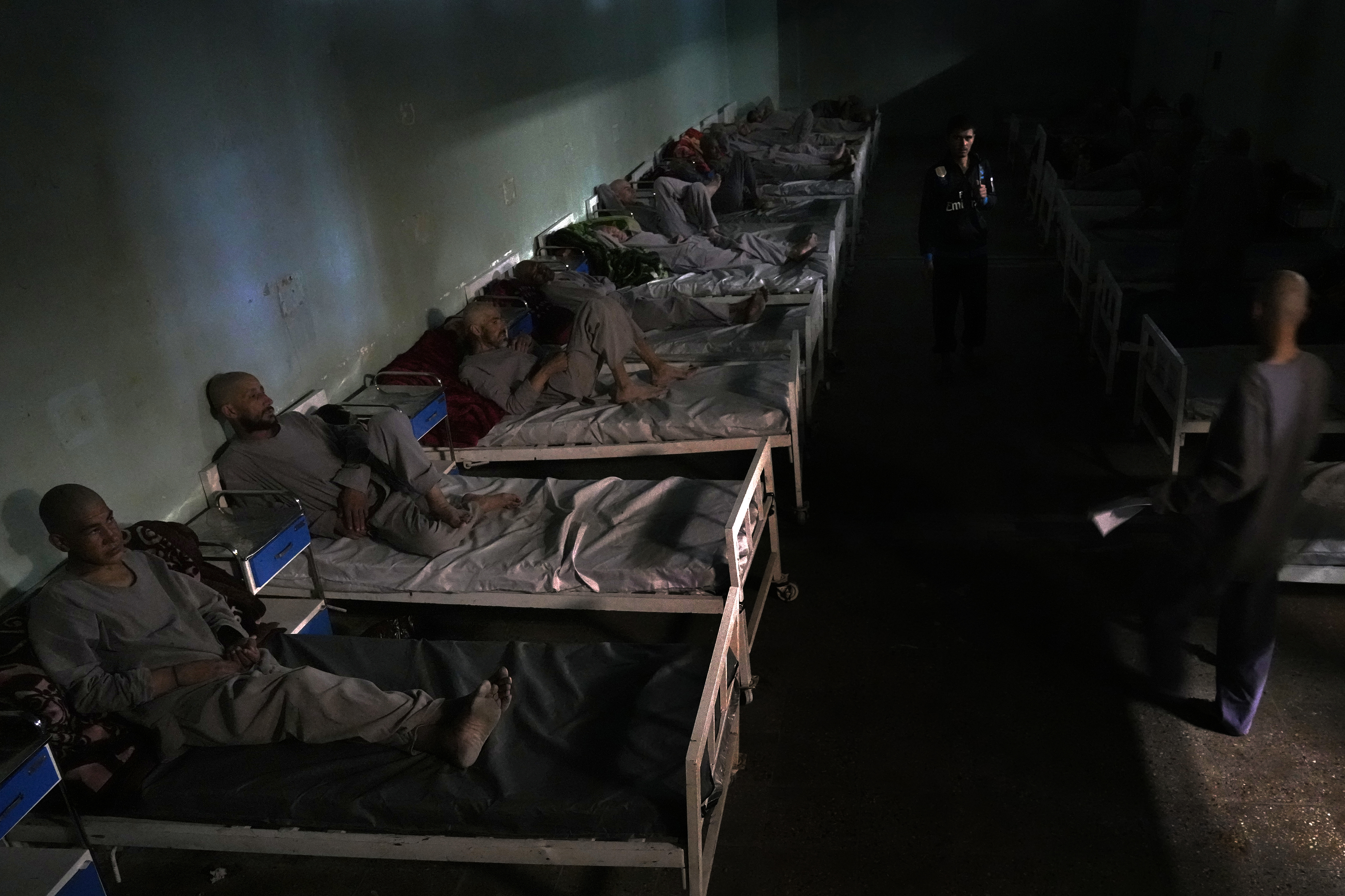 Drug addicts rest on their bed