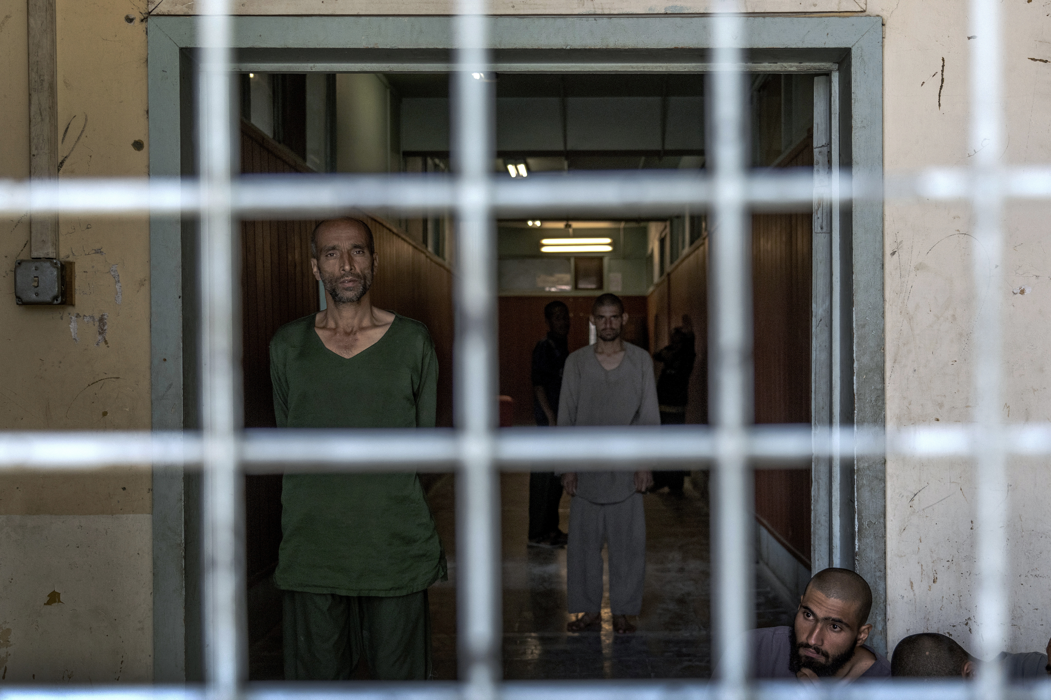 Drug addicts undergoing treatment stand in the detoxification ward