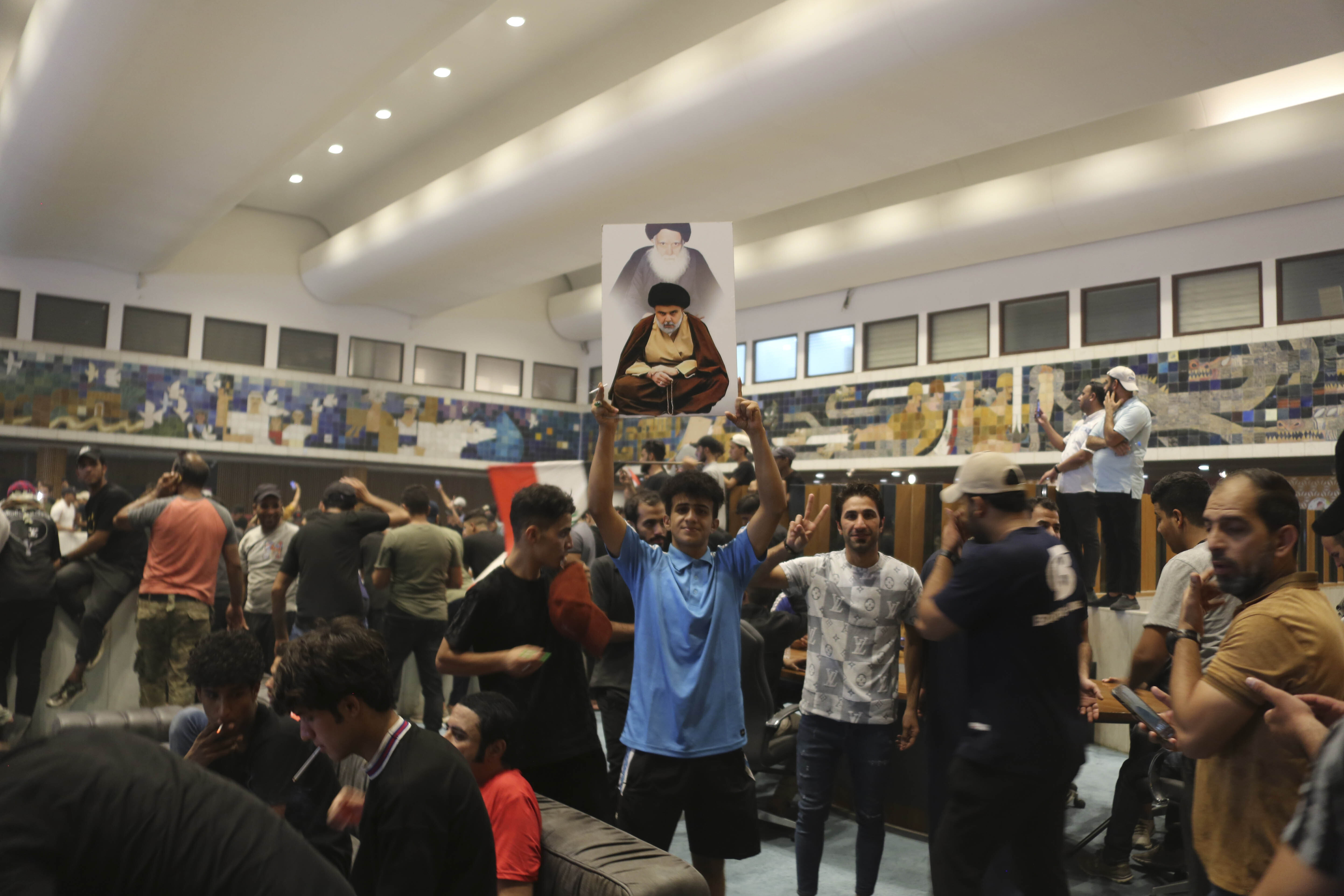 Supporters of the Iraqi cleric Moqtada Sadr gather inside the Iraqi parliament