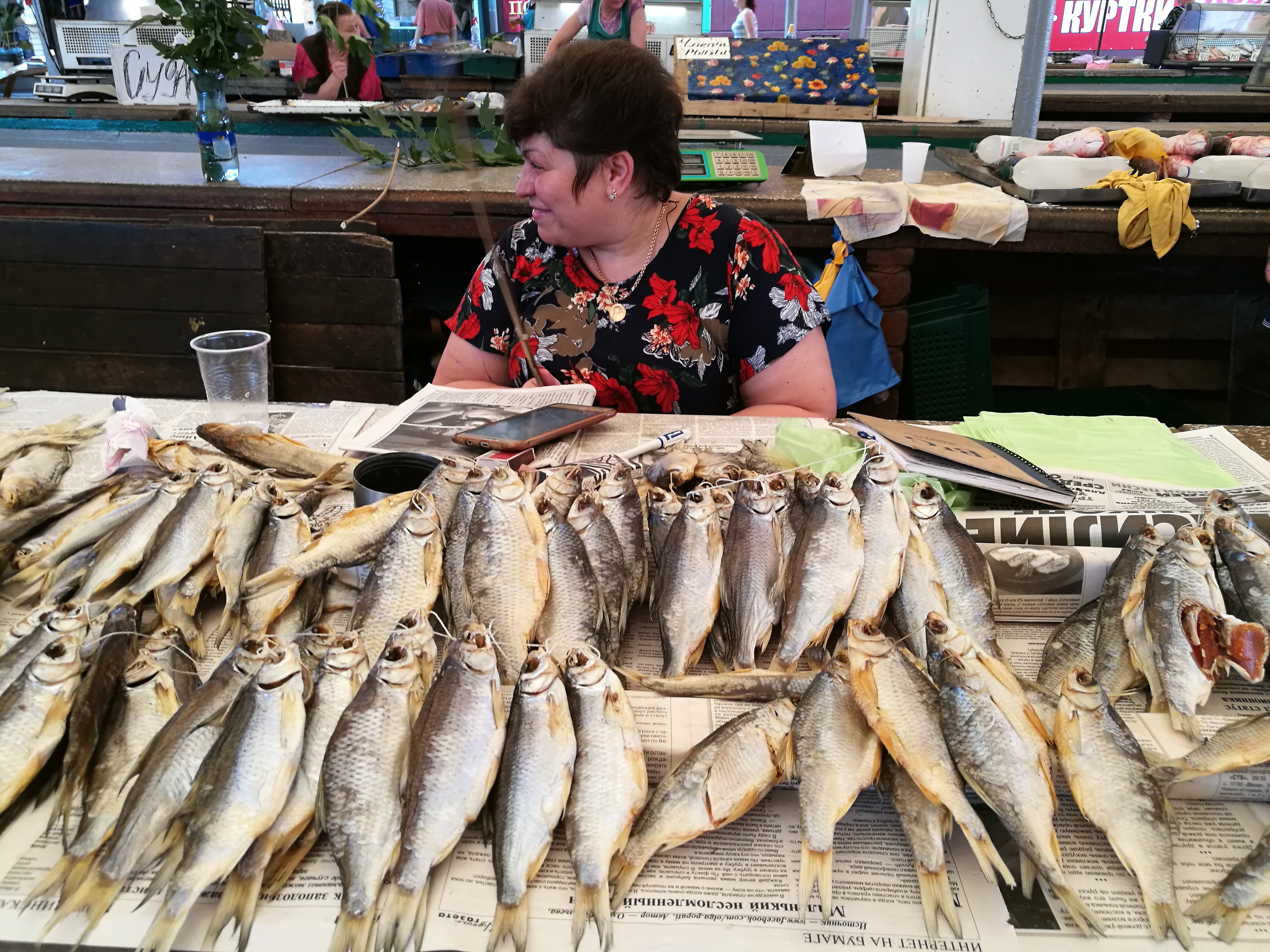 An ethnic Greek woman sells dried fish at a market in Mariupol, Ukraine, in 2019 [Mansur Mirovalev/Al Jazeera]