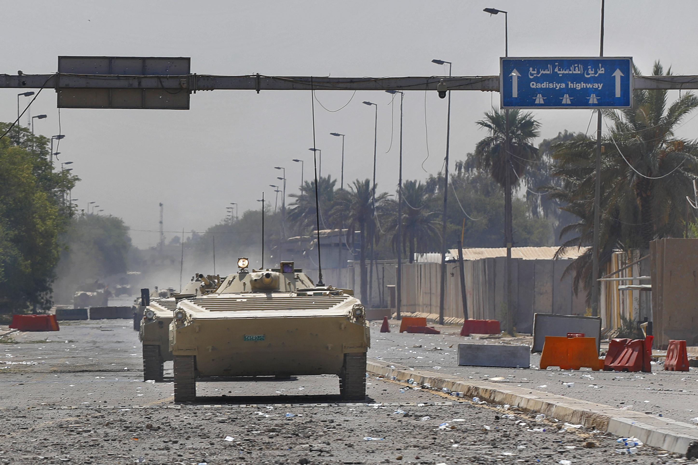 Iraqi security armoured vehicles are pictured during clashes with Saraya al-Salam, the militia wing affiliated with al-Sadr, in Baghdad’s Green Zone