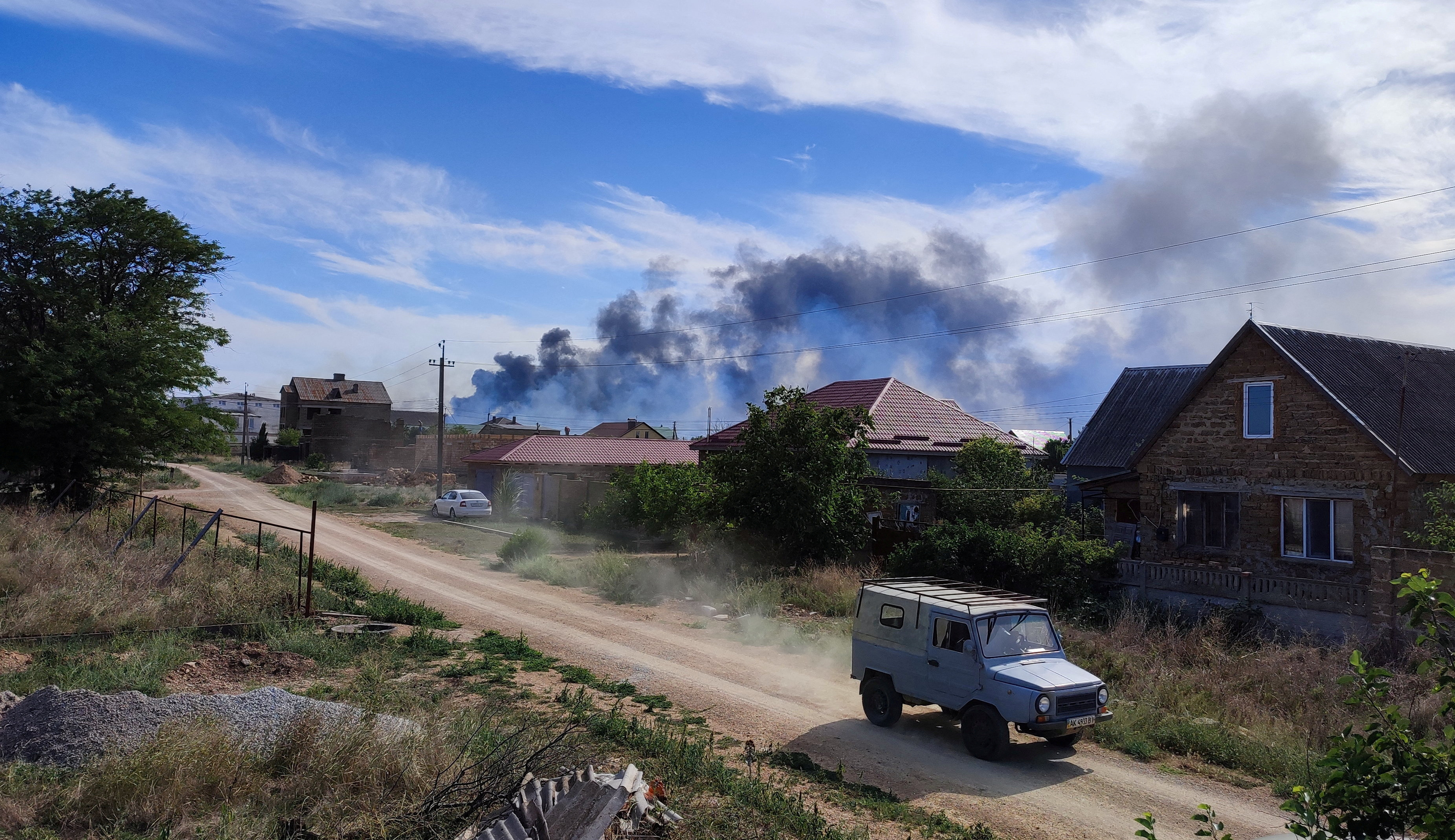 Smoke is seen rising in the Crimean Peninsula following Tuesday's blasts at a Russian air base