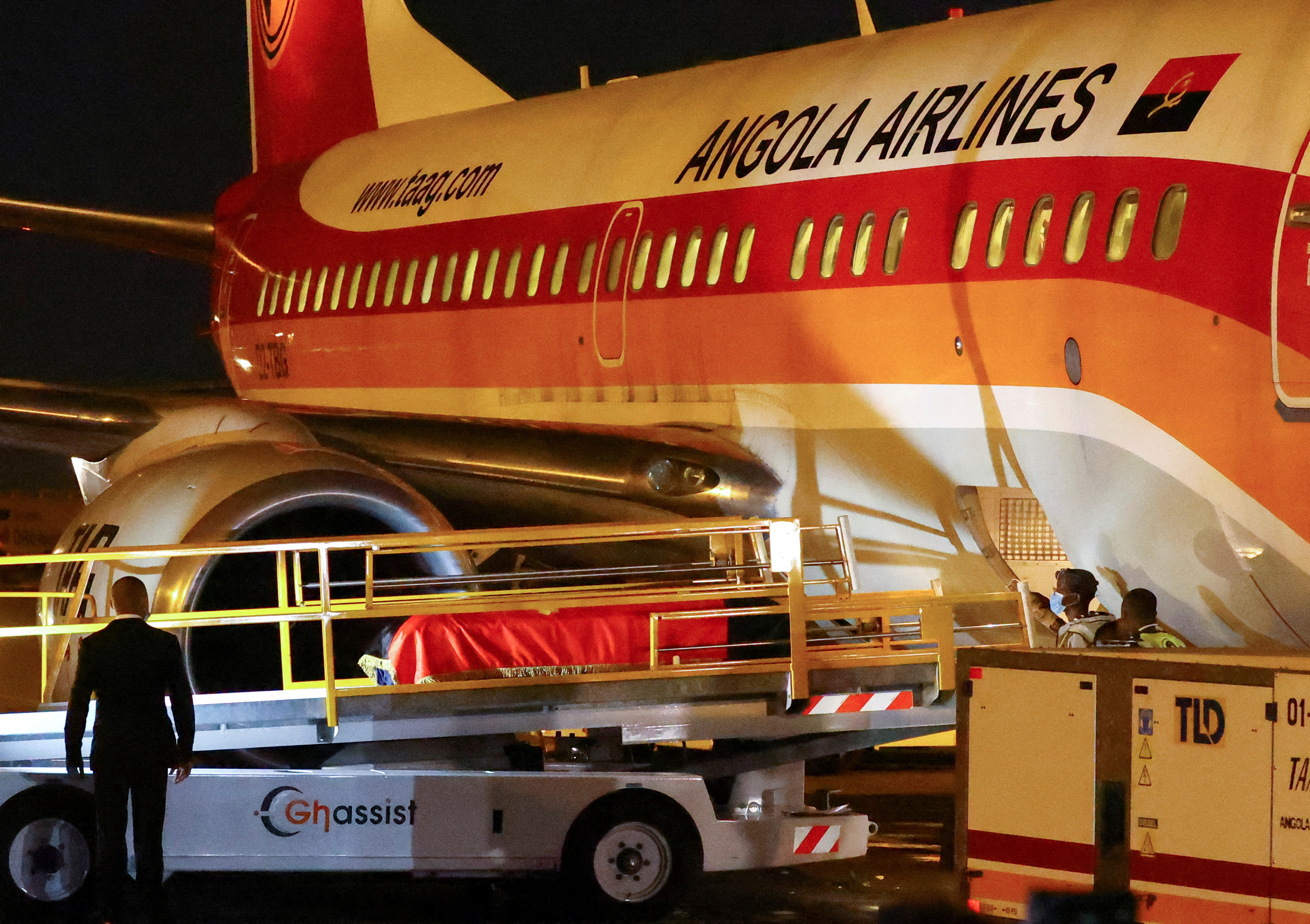The body of Angola's former President Jose Eduardo dos Santos, who died in Spain in July, is offloaded from a plane, at Luanda international airport, in Angola,