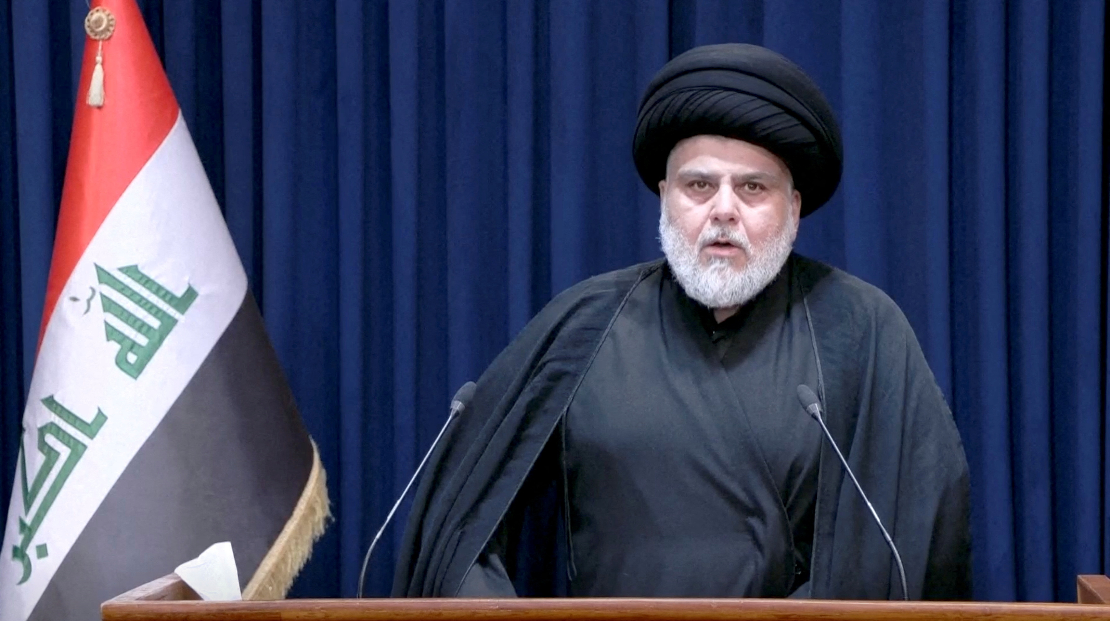 Iraqi Shia leader Muqtada al-Sadr speaks during a news conference in Najaf, Iraq