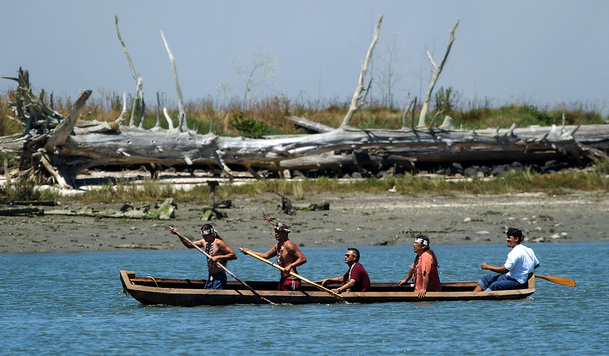 In 2004, members of the Wiyot tribe paddle a dugout redwood canoe across Humboldt Bay, the region where they have lived since time immemorial
