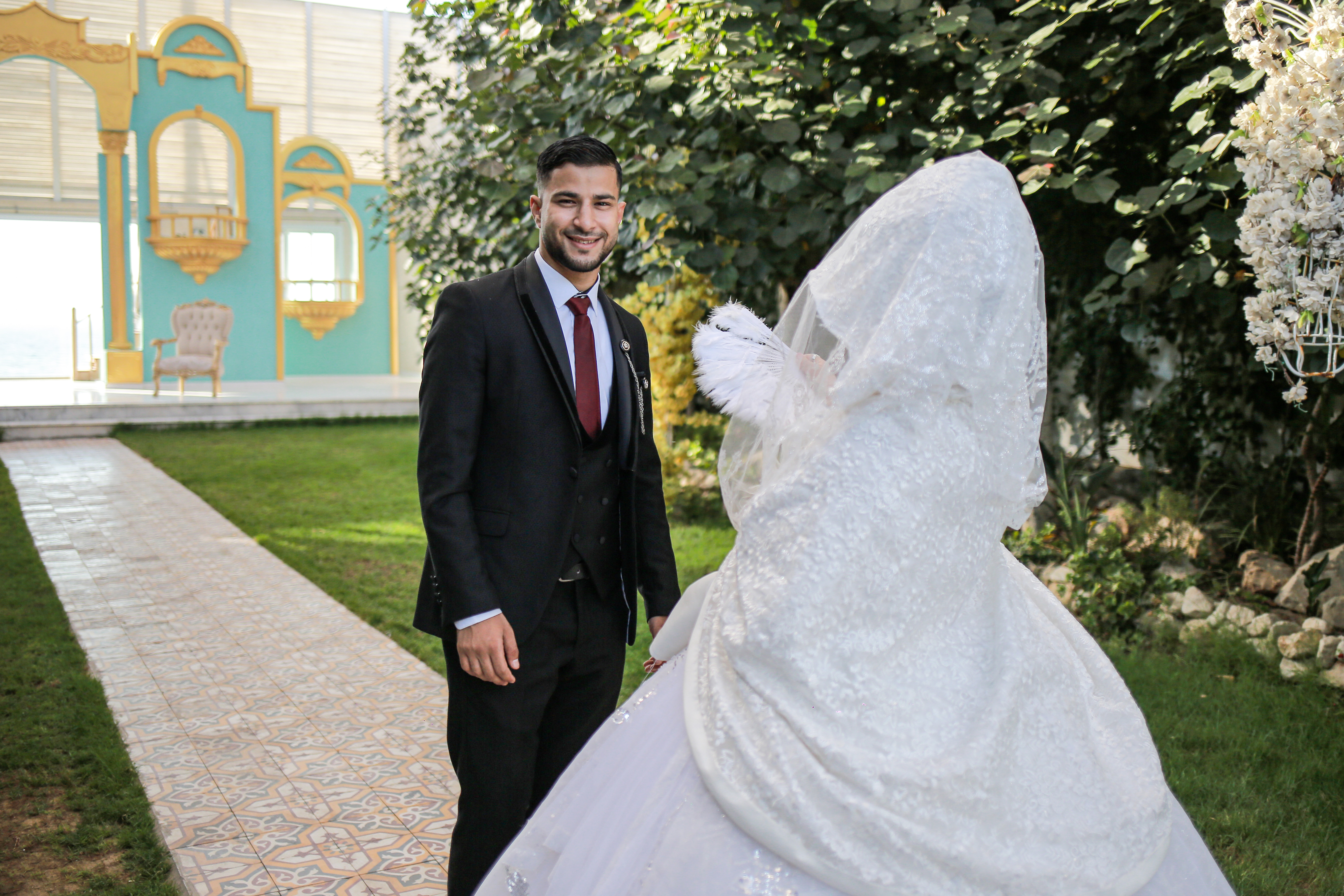 Ahmed Zaqout and his bride Maysa Maliha in a photo shoot held on their wedding day, which took place days after the fighting ended