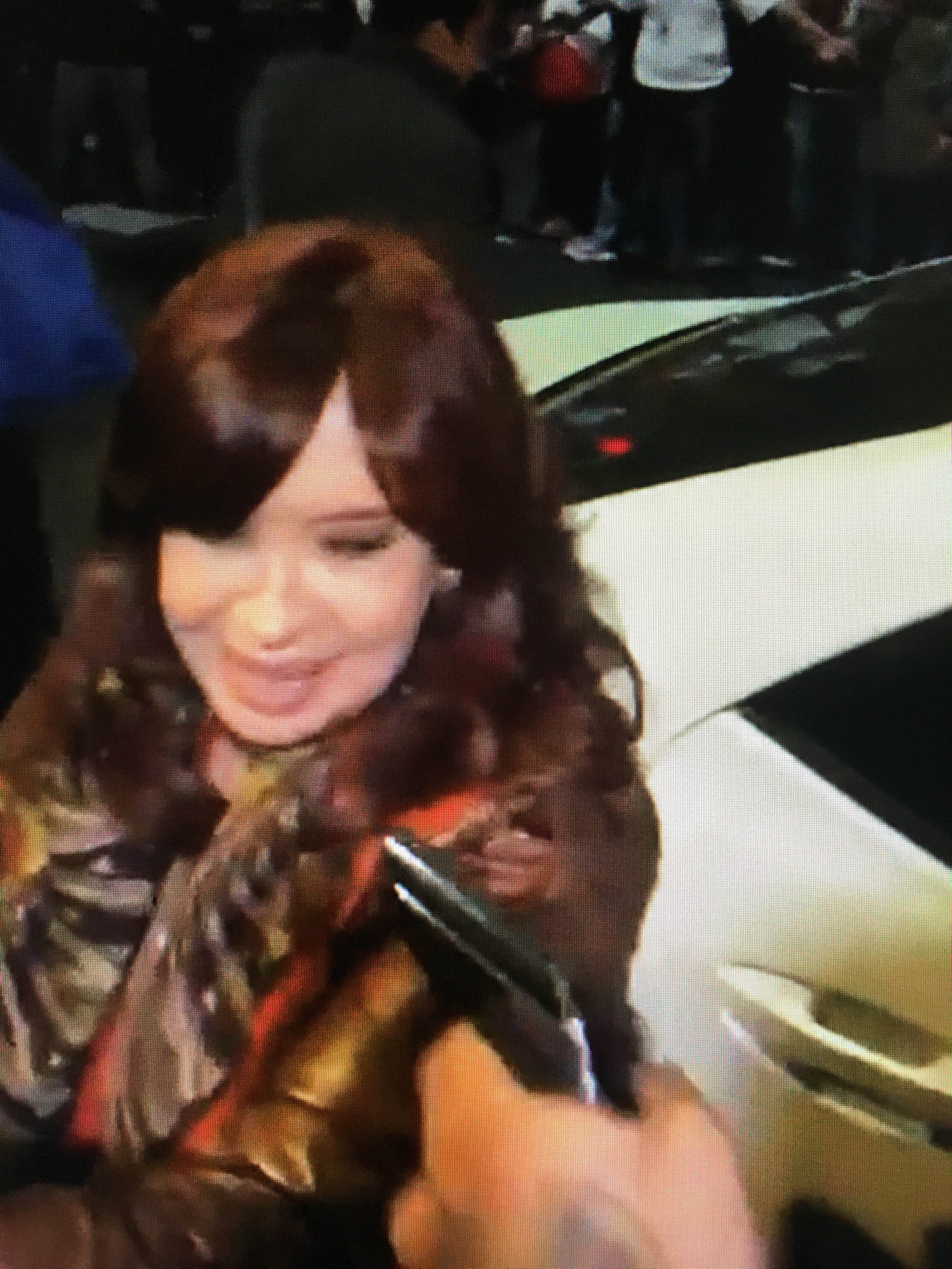 A photo released by the Telam news agency shows a gun pointed at Argentina’s Vice President Cristina Fernandez de Kirchner as she arrives home [Telam via AFP]