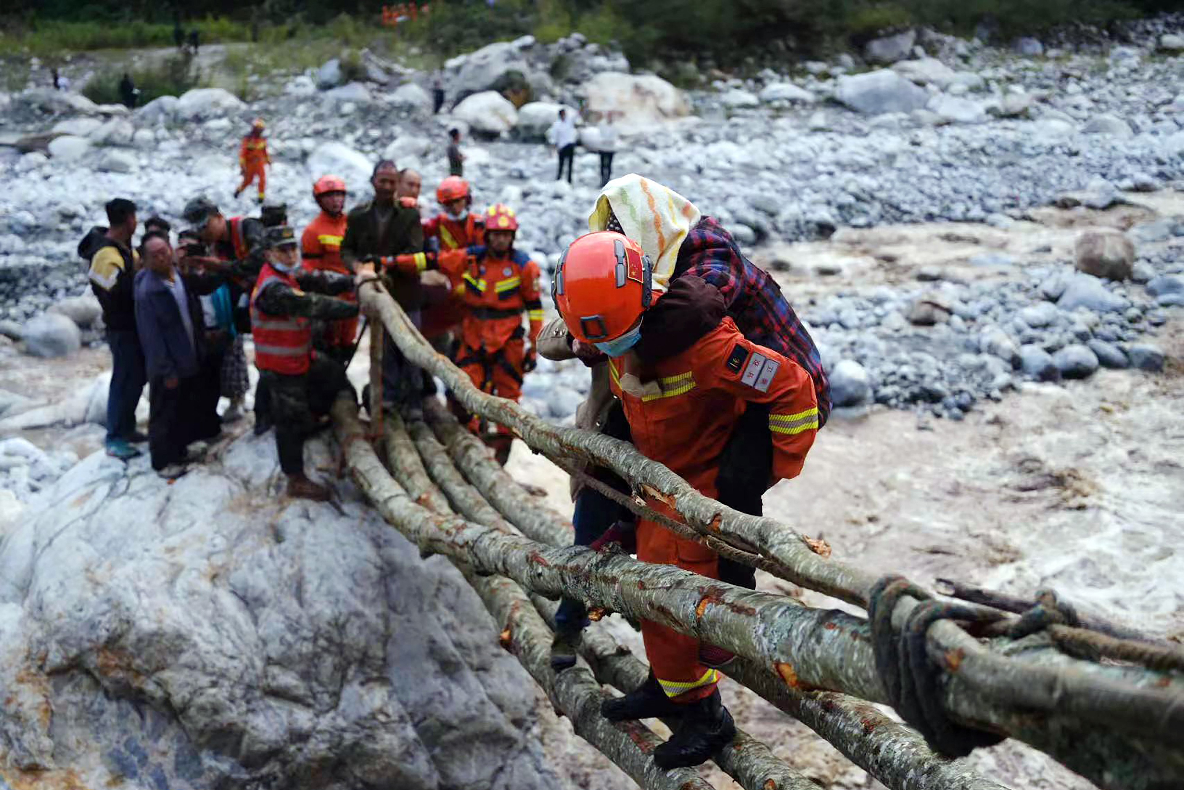 Rescue workers evacuate residents after an earthquake in Luding county in China’s southwestern Sichuan province on September 5, 2022