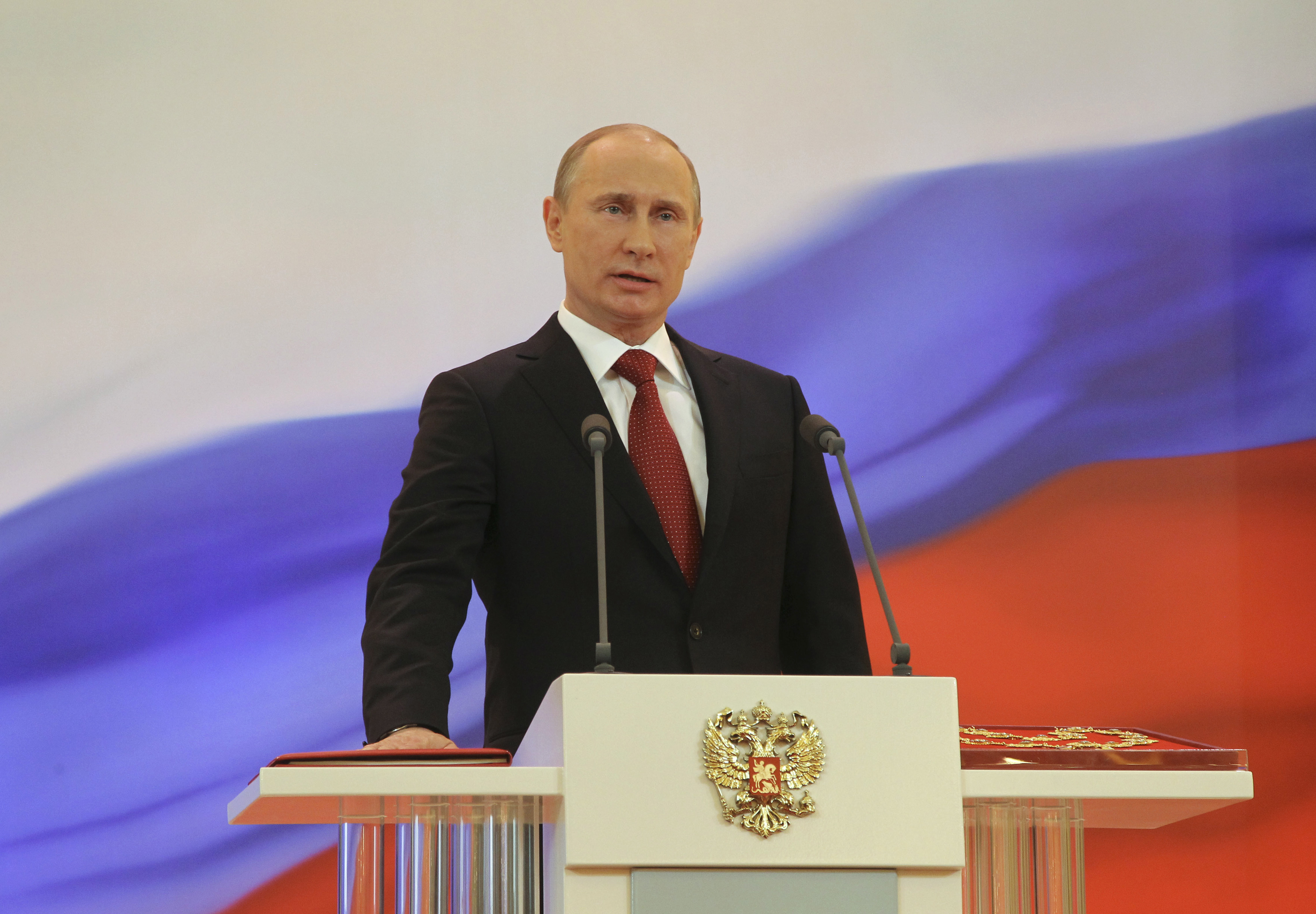 Vladimir Putin is sworn in as the new Russian president during a ceremony at the Kremlin in Moscow, May 7, 2012. Putin was sworn in as Russia's president in a glittering Kremlin ceremony on Monday, starting a six-year term in which he faces growing dissent, economic problems and bitter political rivalries. REUTERS/Vladimir Rodionov/RIA Novosti/Pool (RUSSIA - Tags: POLITICS) THIS IMAGE HAS BEEN SUPPLIED BY A THIRD PARTY. IT IS DISTRIBUTED, EXACTLY AS RECEIVED BY REUTERS, AS A SERVICE TO CLIENTS