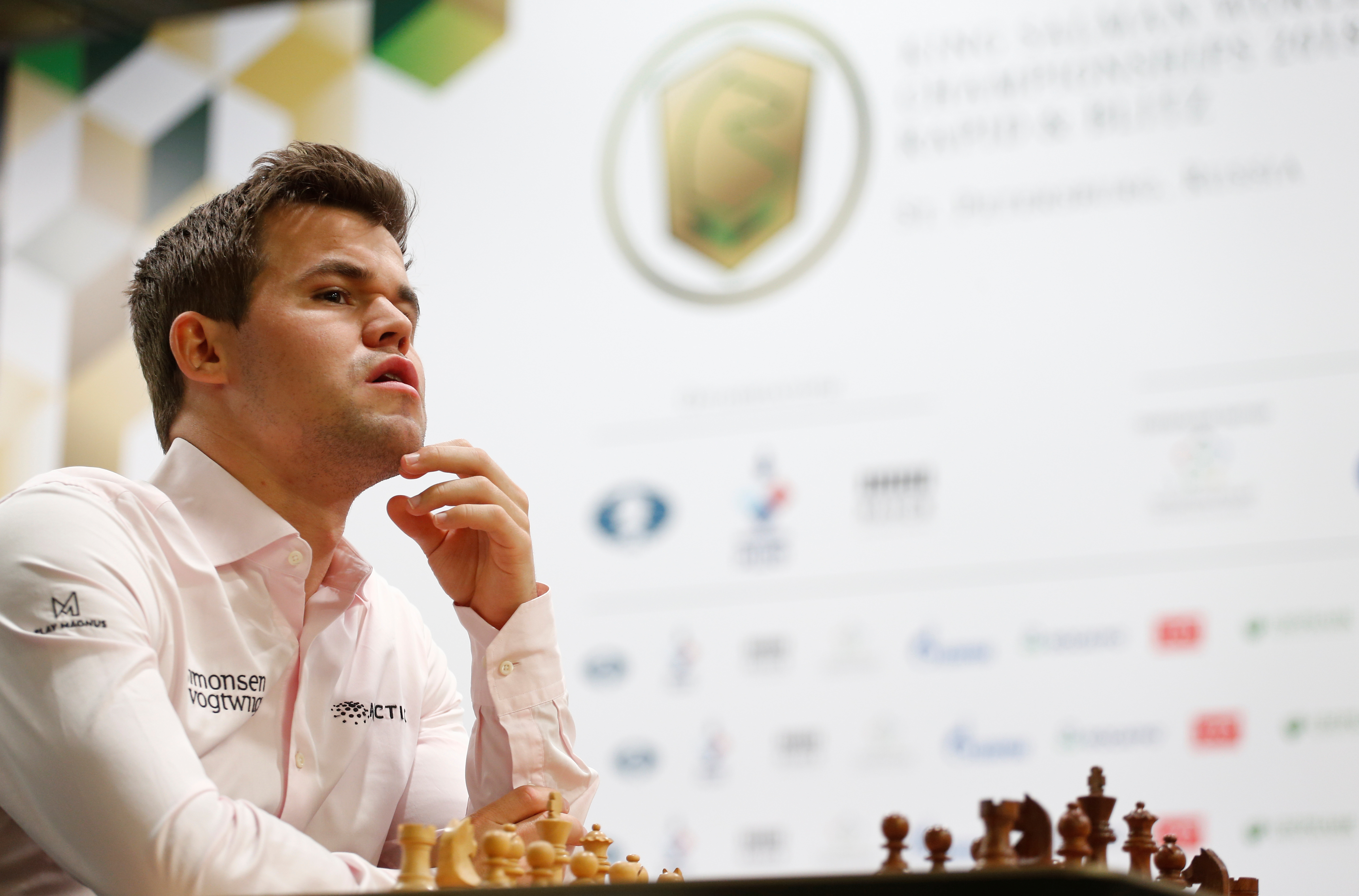 2018 World Rapid and Blitz Chess Championships - Rapid Open - Saint Petersburg, Russia - December 26, 2018. Magnus Carlsen of Norway sits in front of a chess board before a game. REUTERS/Anton Vaganov