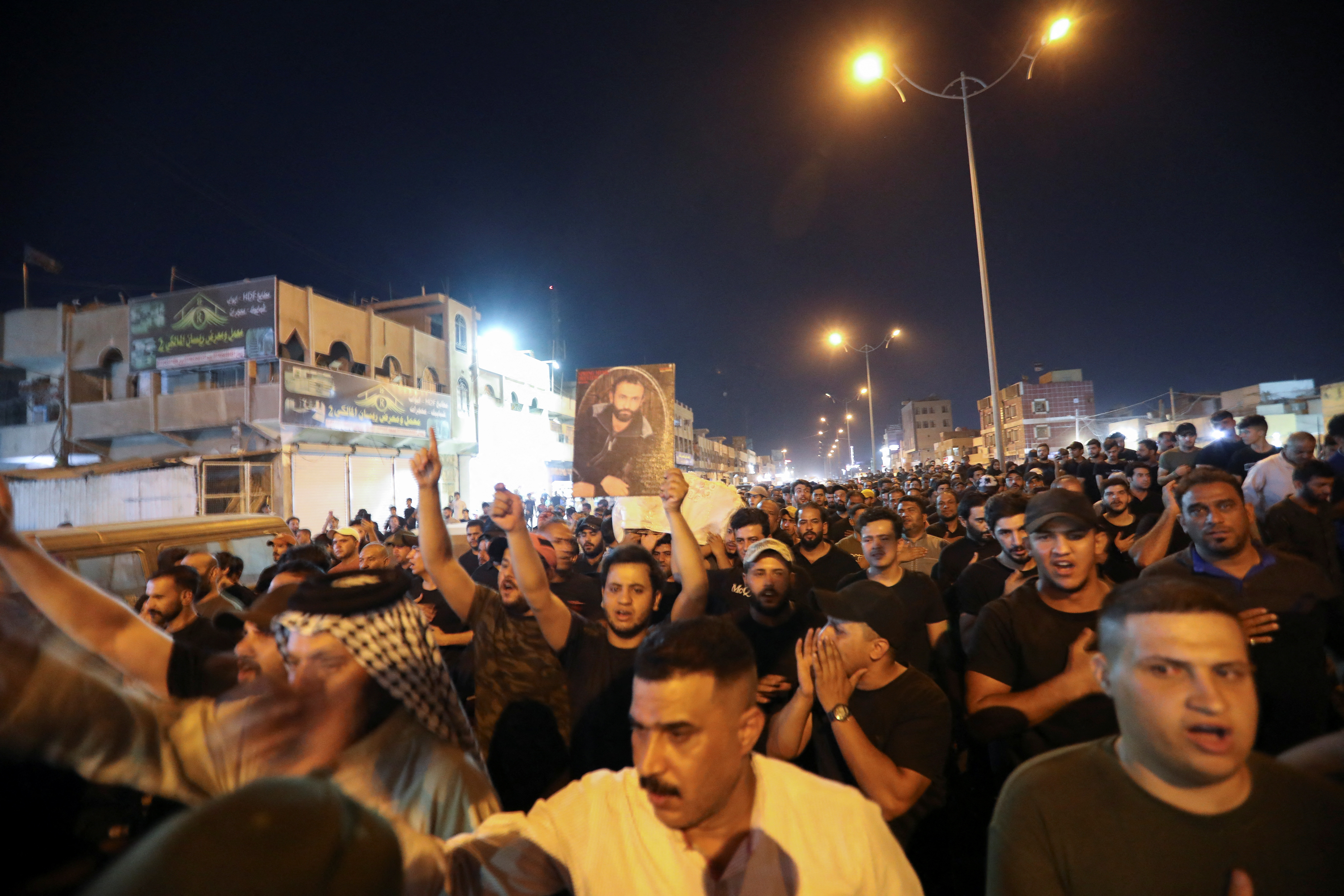 People carry the coffin of one of the supporters of Iraqi populist leader Muqtada al-Sadr in Iraq.