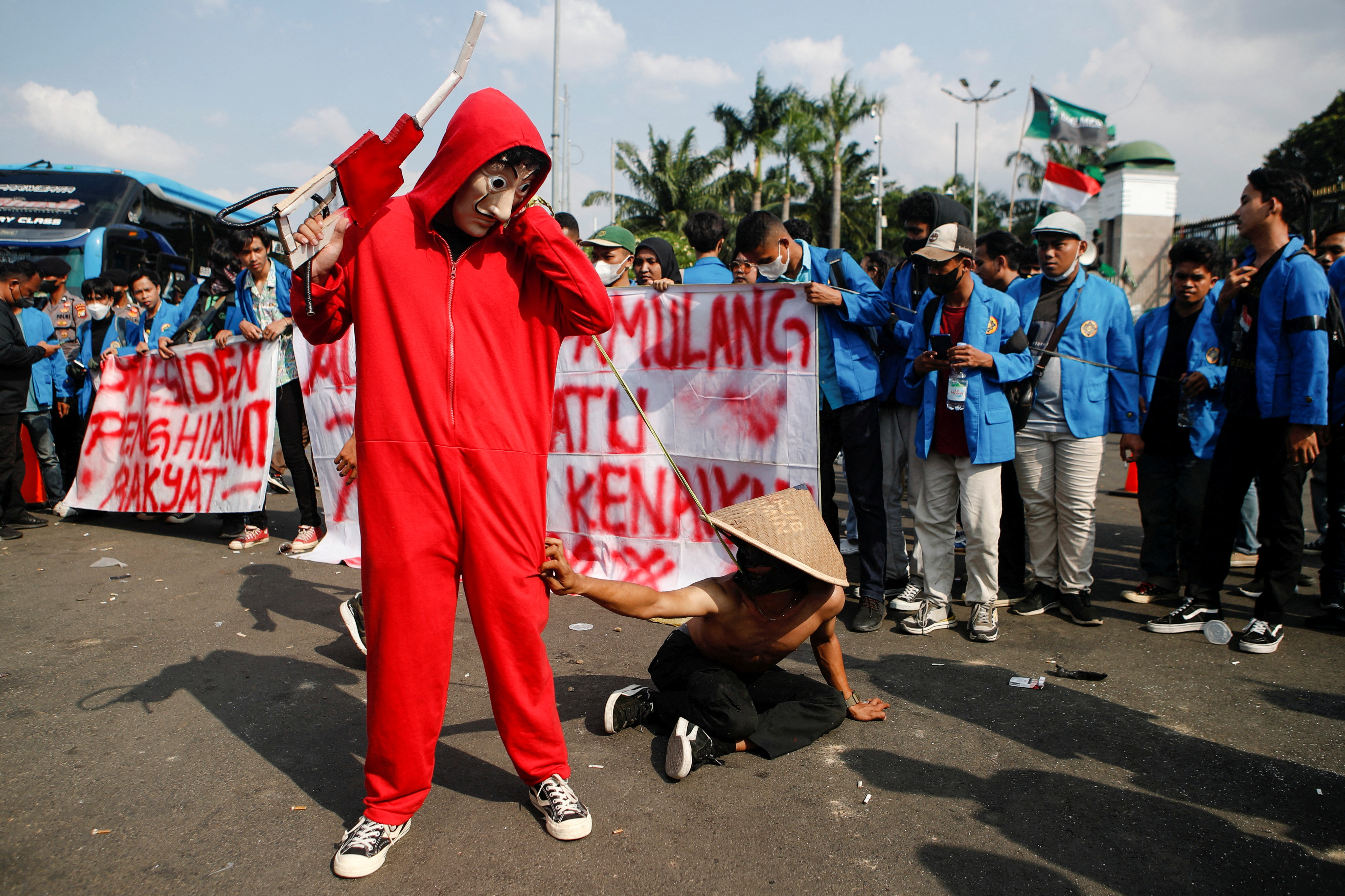 University students stage a theatrical show during a protest against the government's recent fuel price hike decision outside the Indonesian Parliament in Jakarta, Indonesia, on September 6, 2022 [Ajeng Dinar Ulfiana/Reuters]