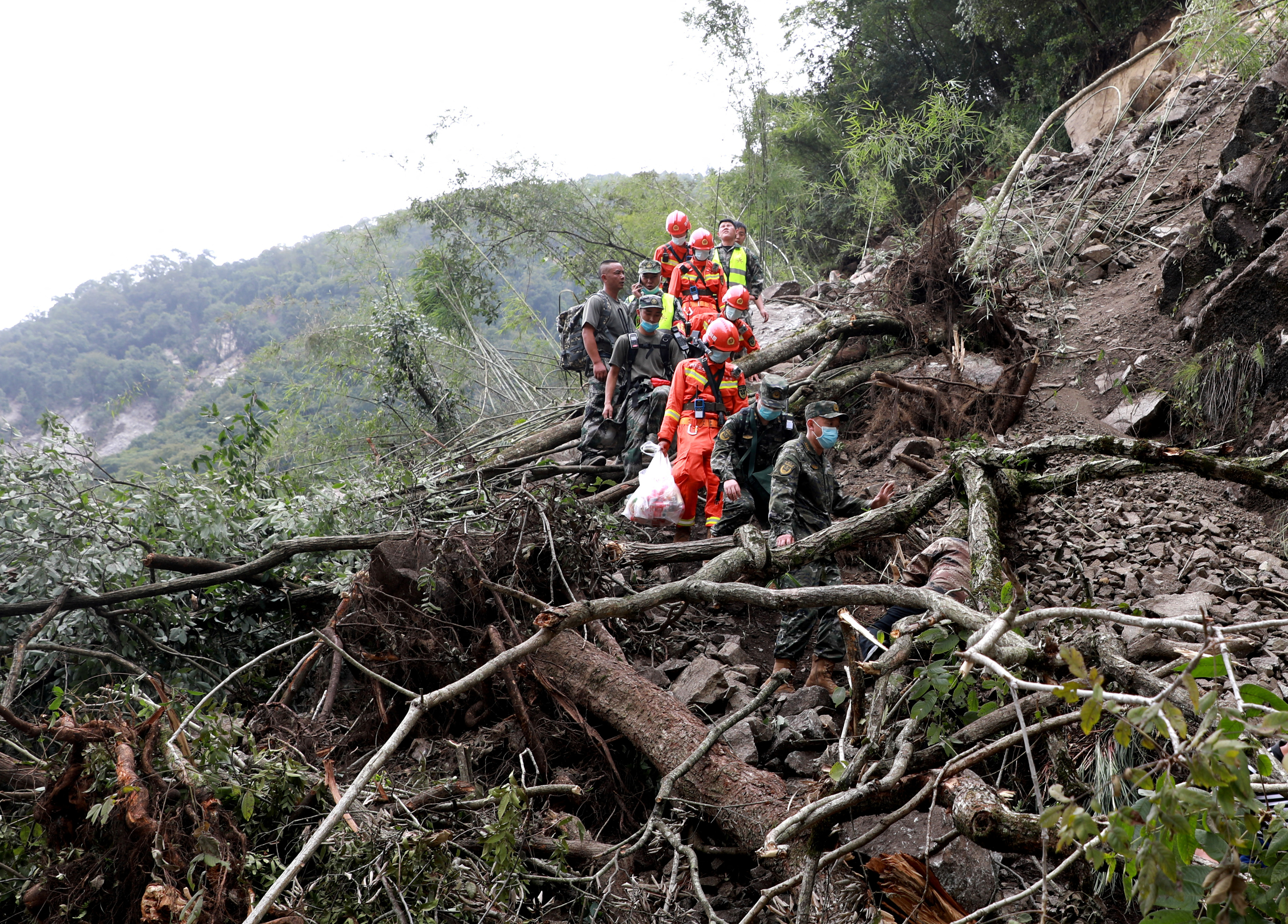 Paramilitary police officers head to Shimian county for search-and-rescue operations [CNS via Reuters]