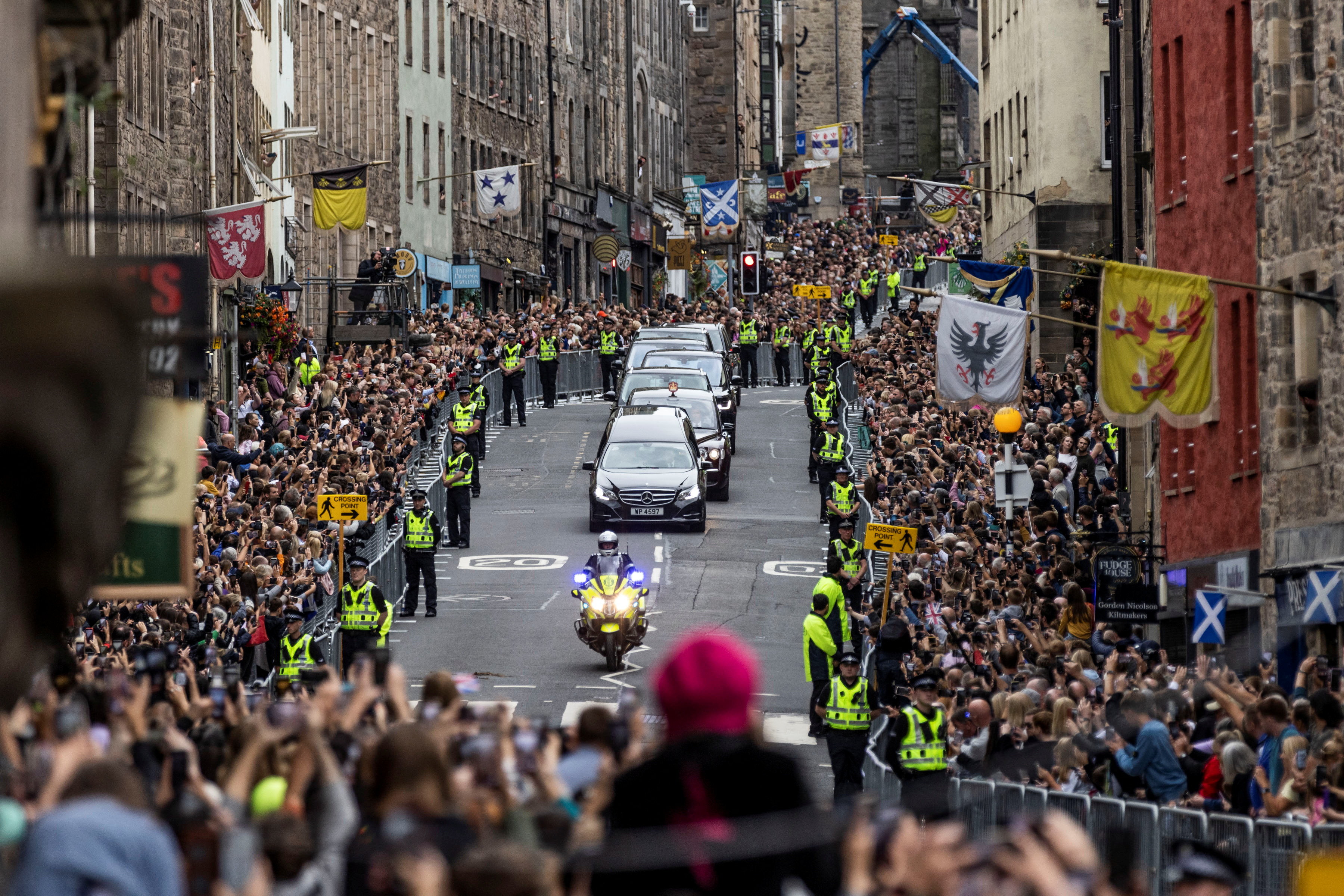 People crowded the pavements on Sunday as Queen Elizabeth’s funeral cortege arrived in Edinburgh from Balmoral Castle where she died last Thursday