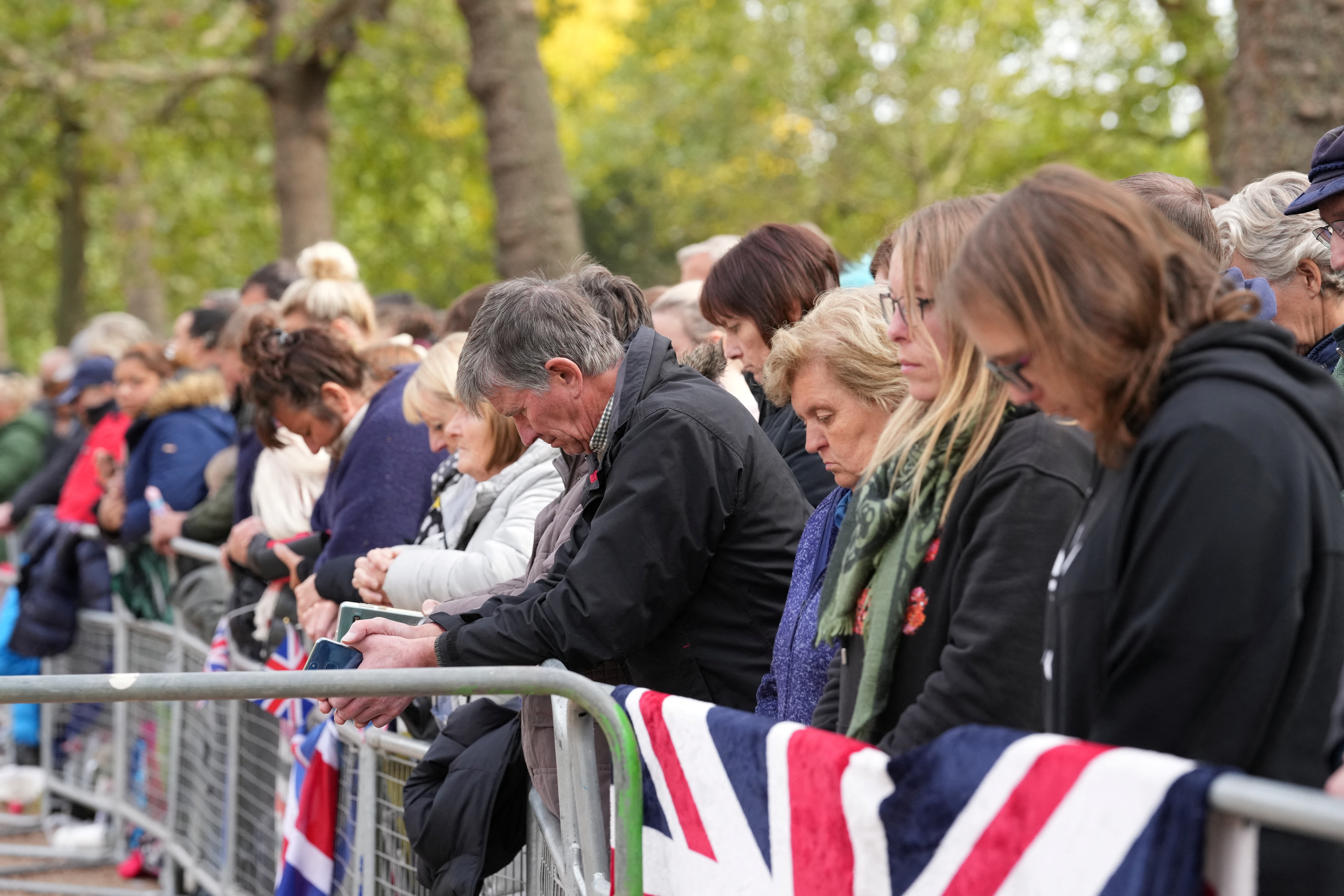 People bow their heads.
