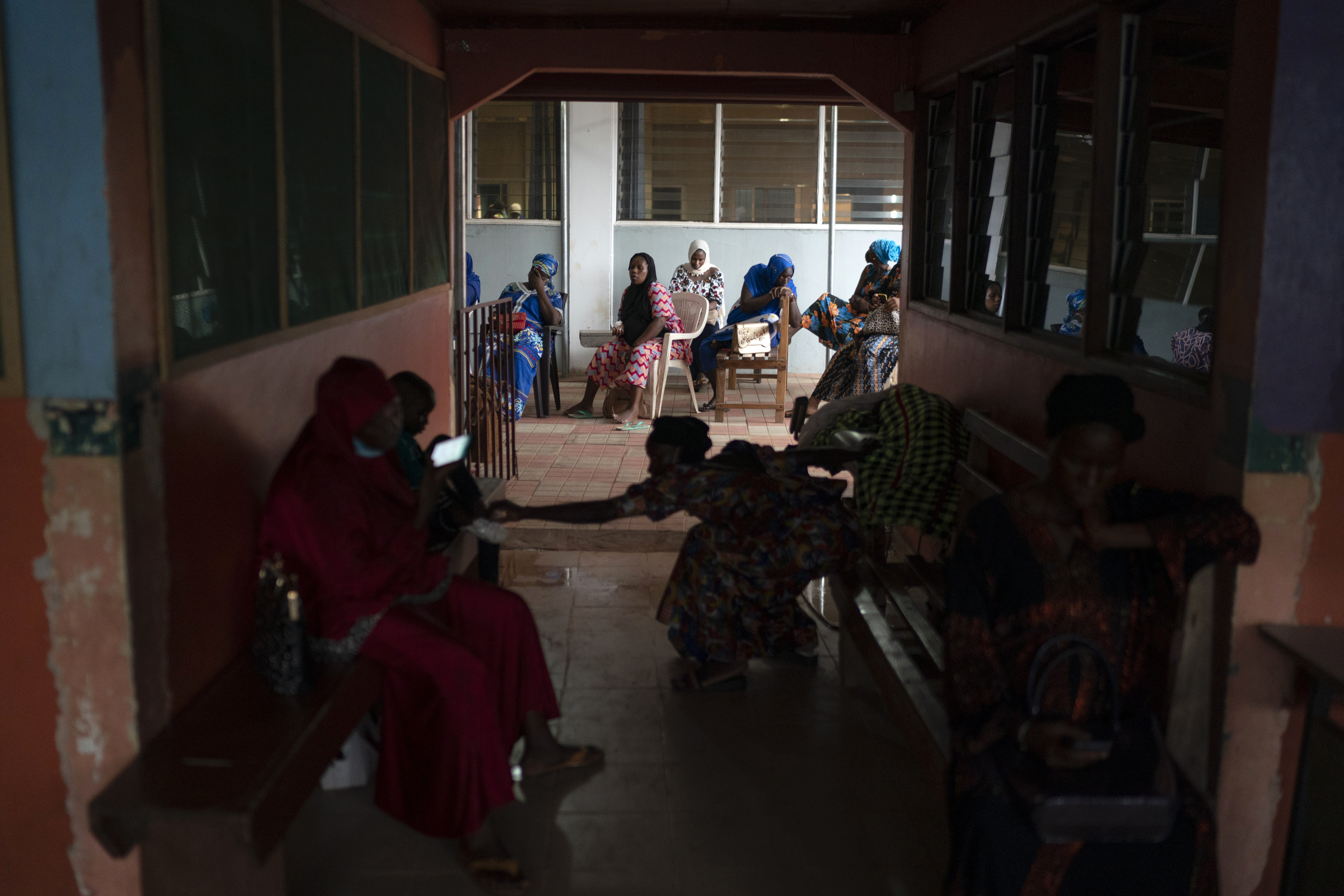 Pregnant women wait to be assisted at the Bundung Maternal and Child Health Hospital in Serrekunda