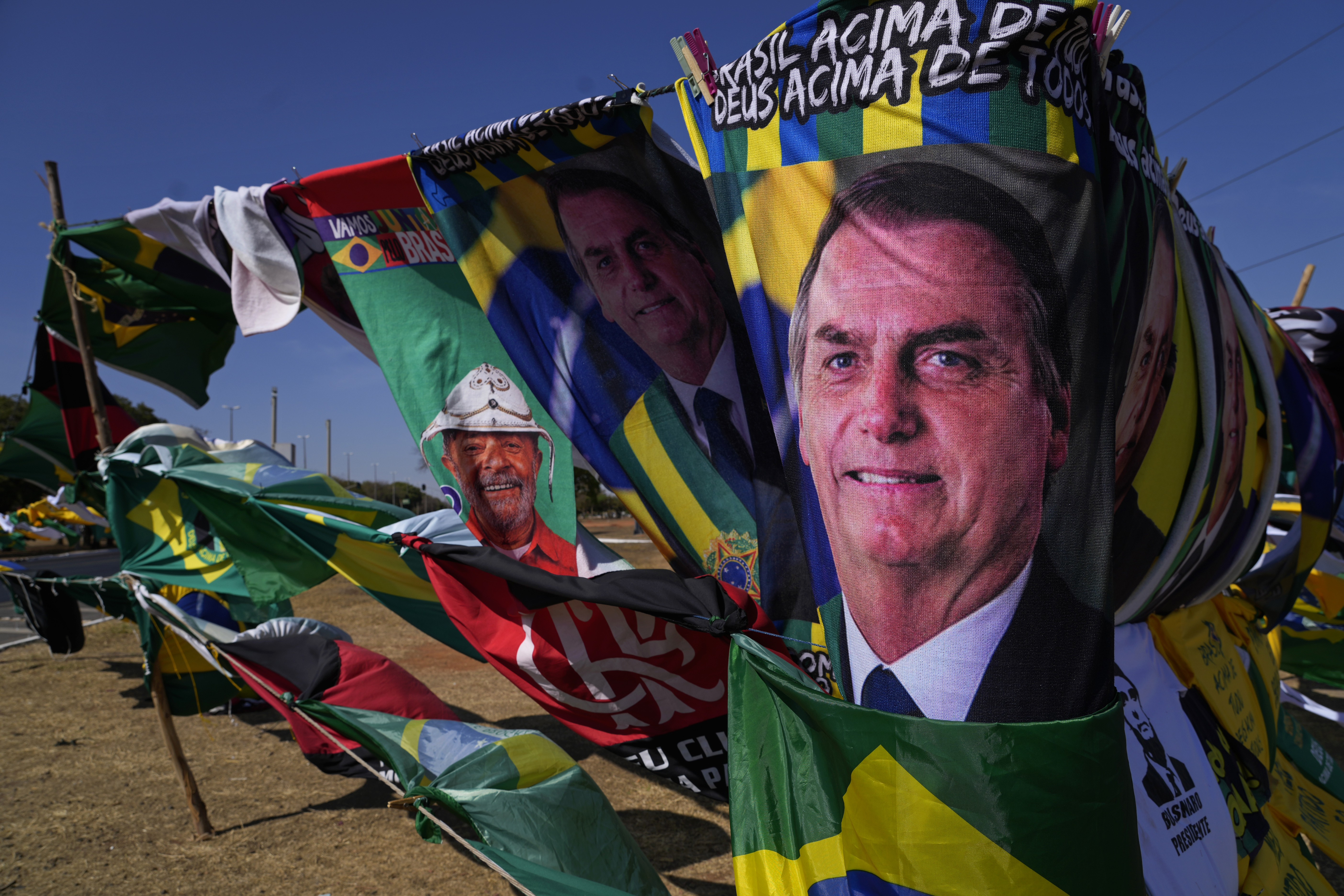 Presidential election campaign flags showing President Jair Bolsonaro and his rival former President Luiz Inacio Lula da Silva for sale outside the Supreme Electoral Court in Brasilia