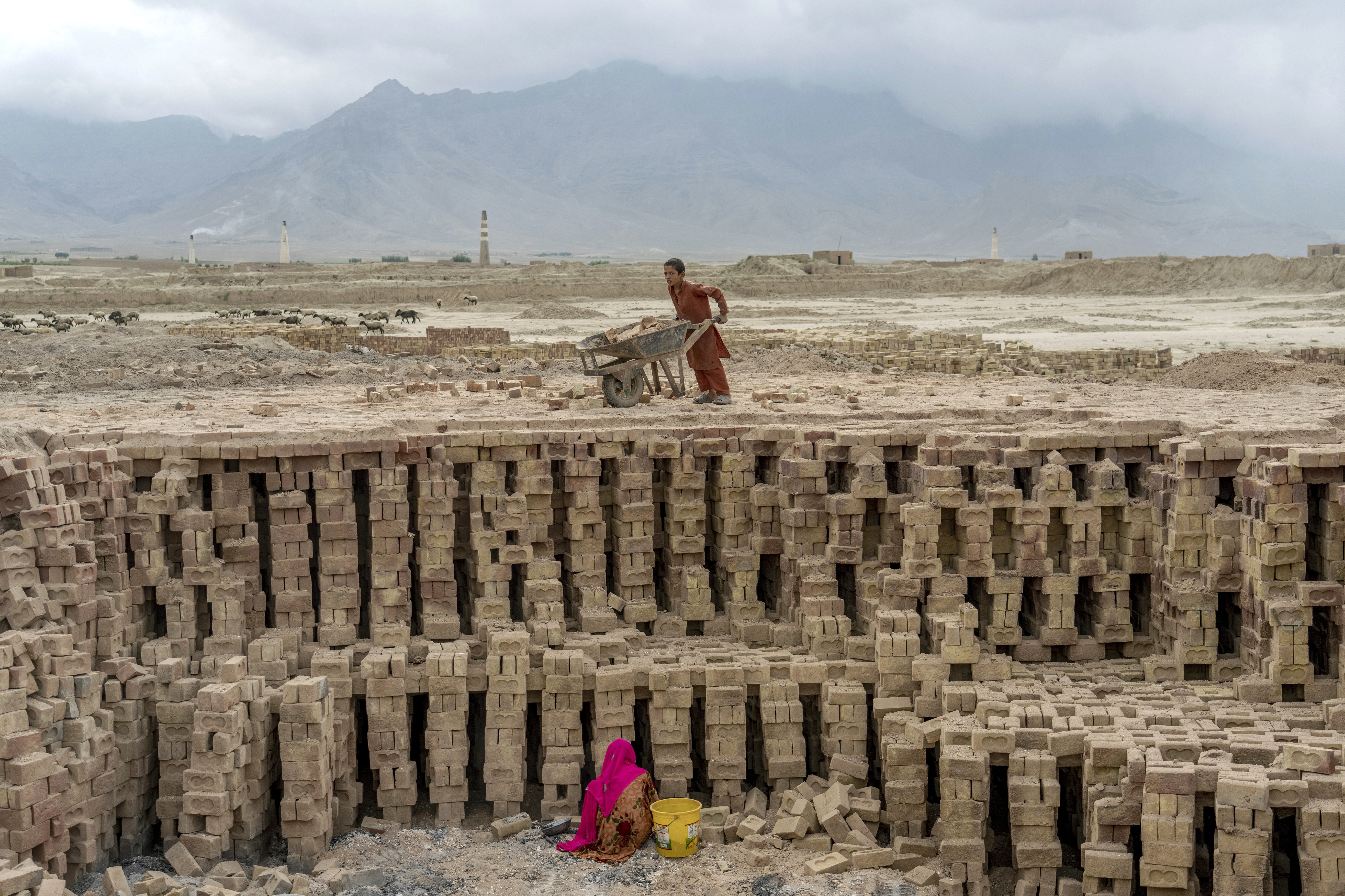 Afghan children working at a brick factory