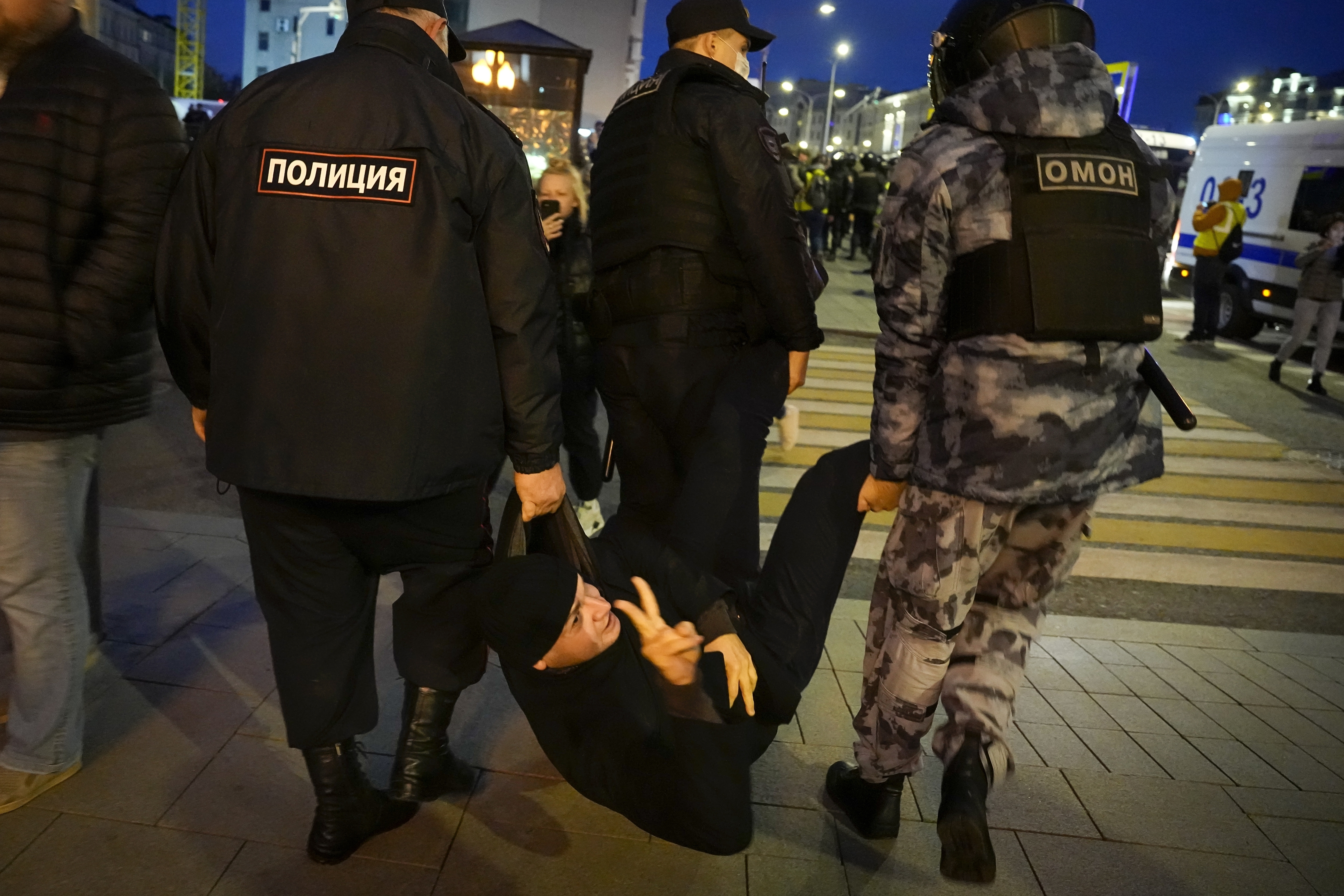 Police detain a demonstrator during a protest against mobilisation in Moscow, Russia, Wednesday, September 21, 2022