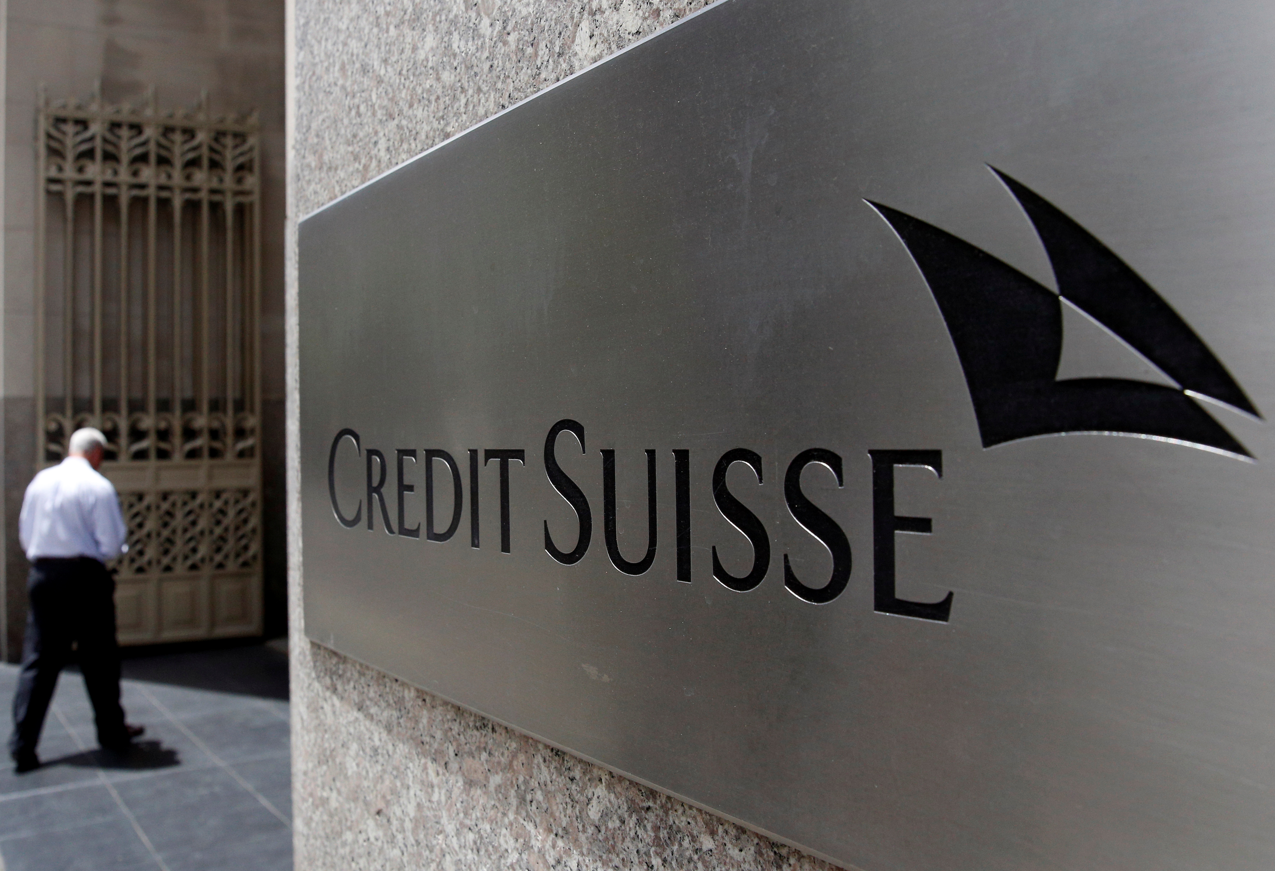 A man enters the Credit Suisse offices in the Manhattan borough of New York City, the US.