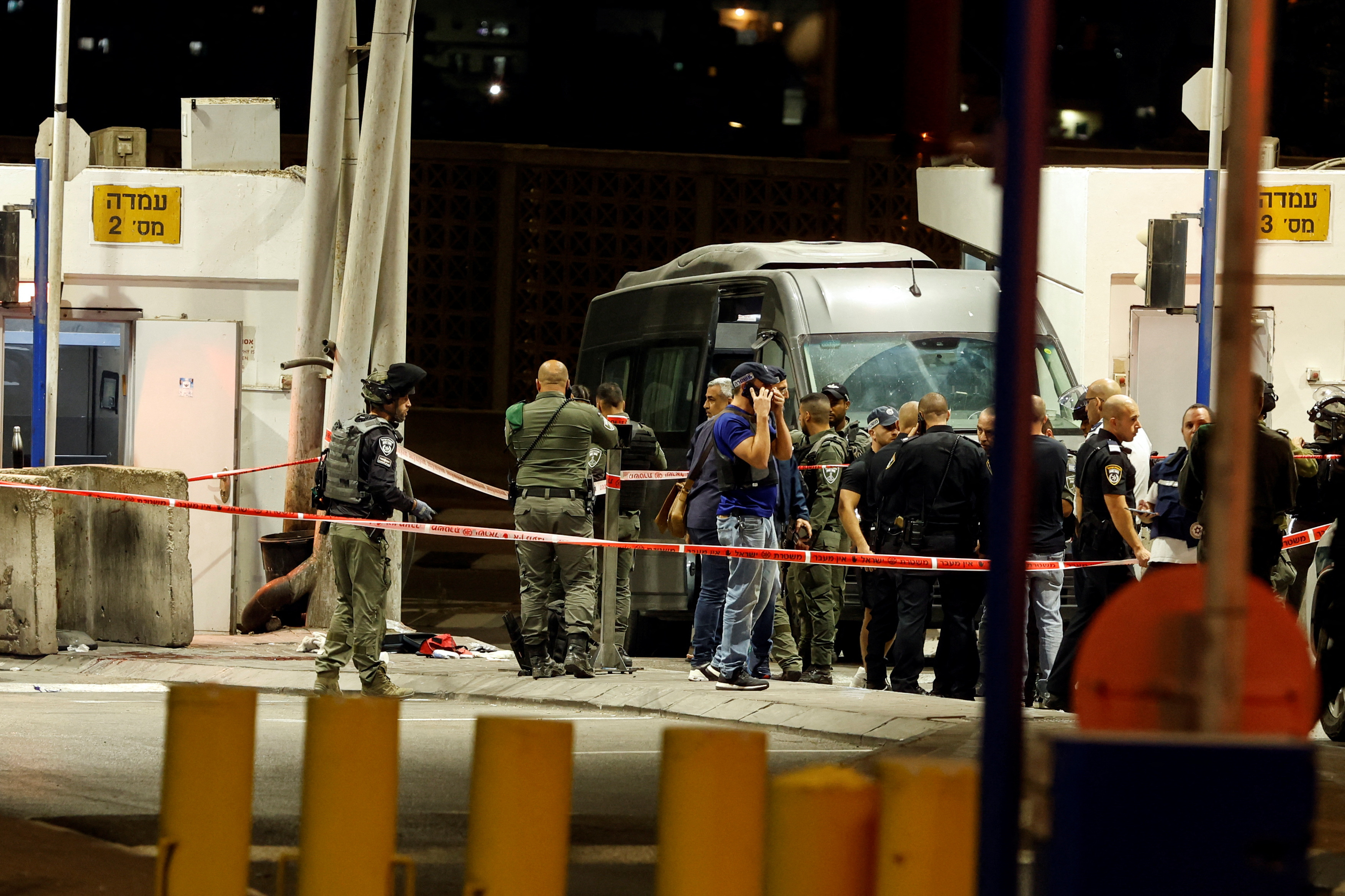 Israeli security forces are seen following a shooting incident at a checkpoint in occupied East Jerusalem, October 8, 2022