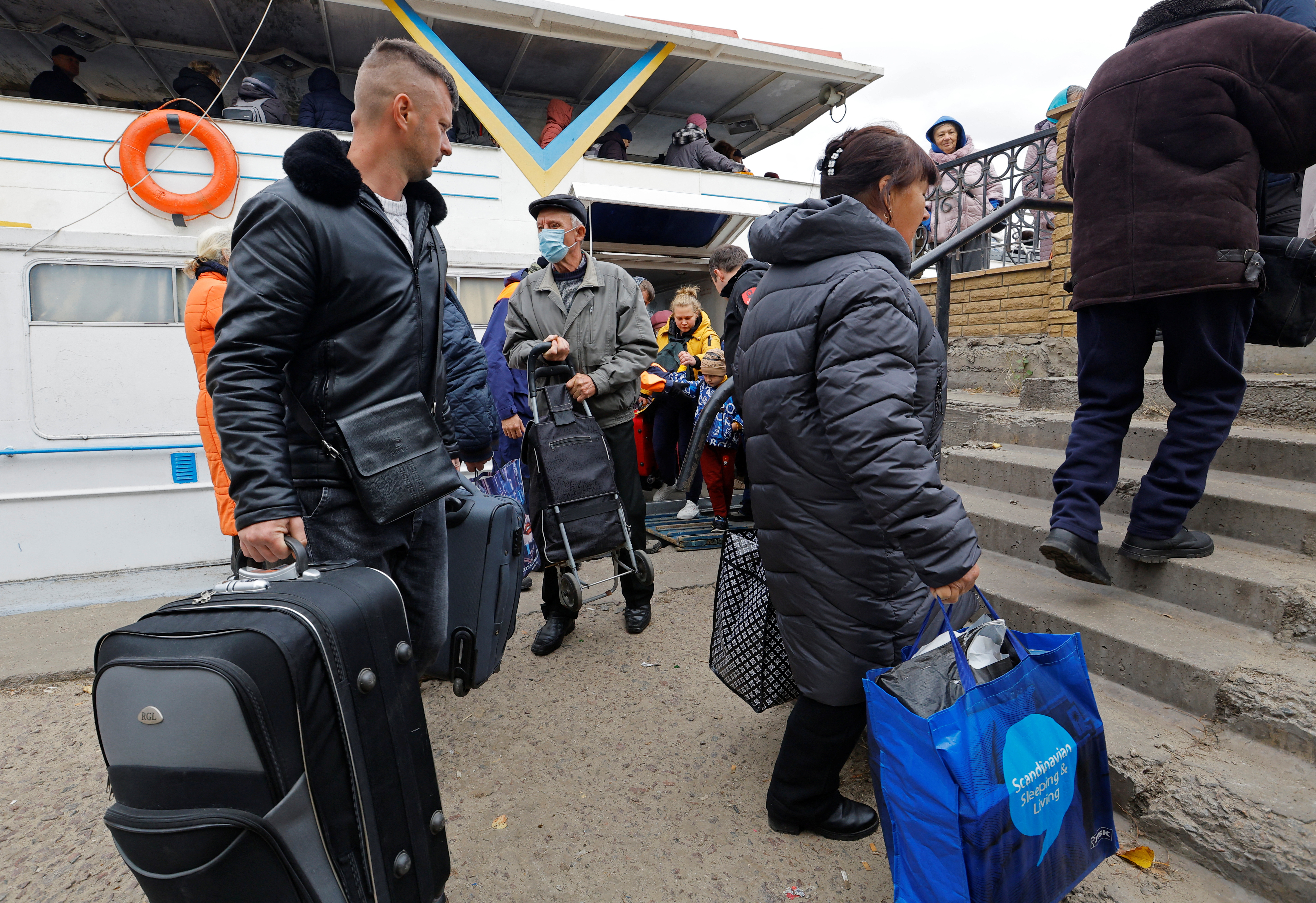 Civilians evacuated from the Russian-controlled city of Kherson