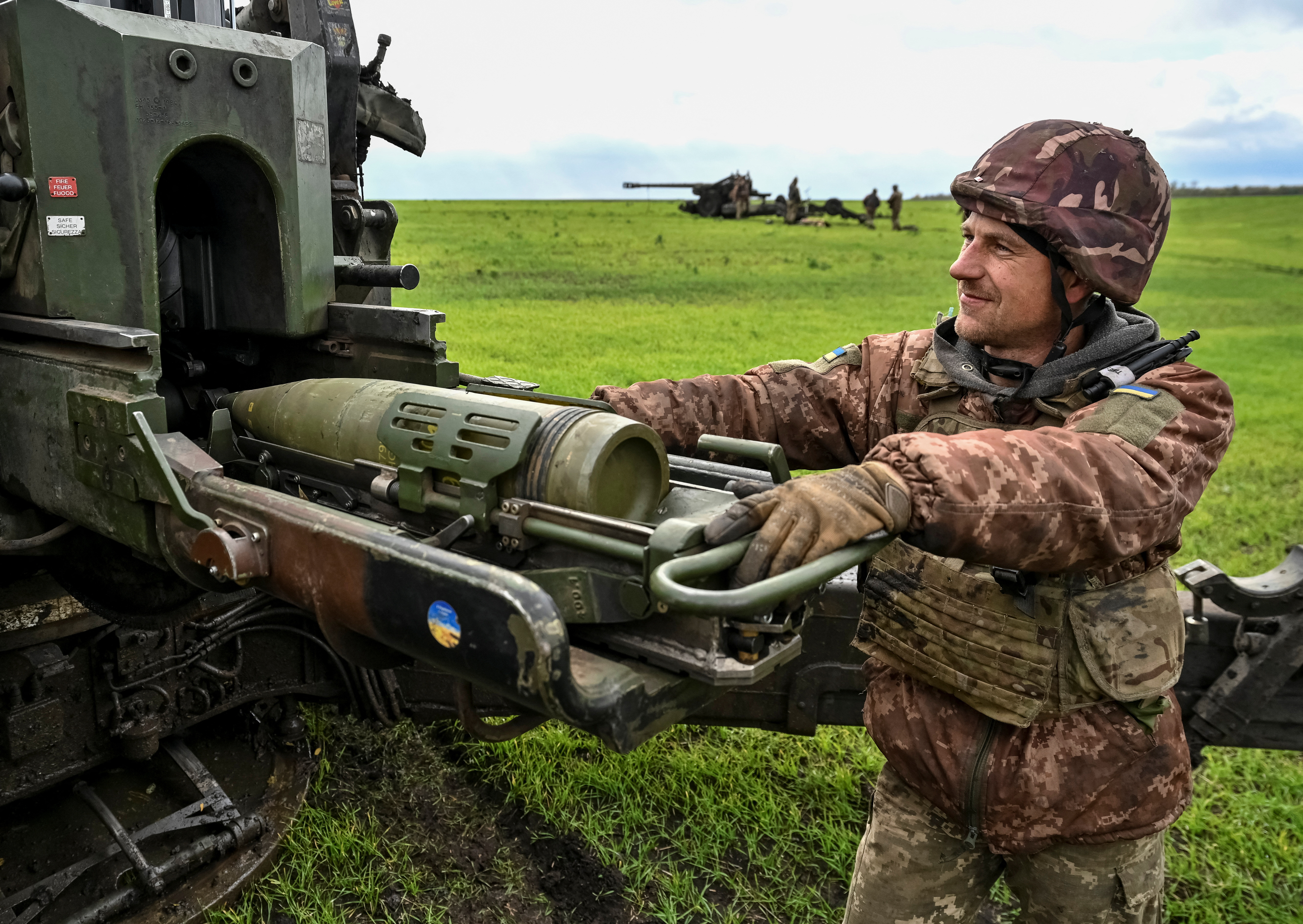 Ukrainian service members prepare to shoot from a towed howitzer FH-70 at a front line, as Russia's attack on Ukraine continues, in Zaporizhzhia Region, Ukraine