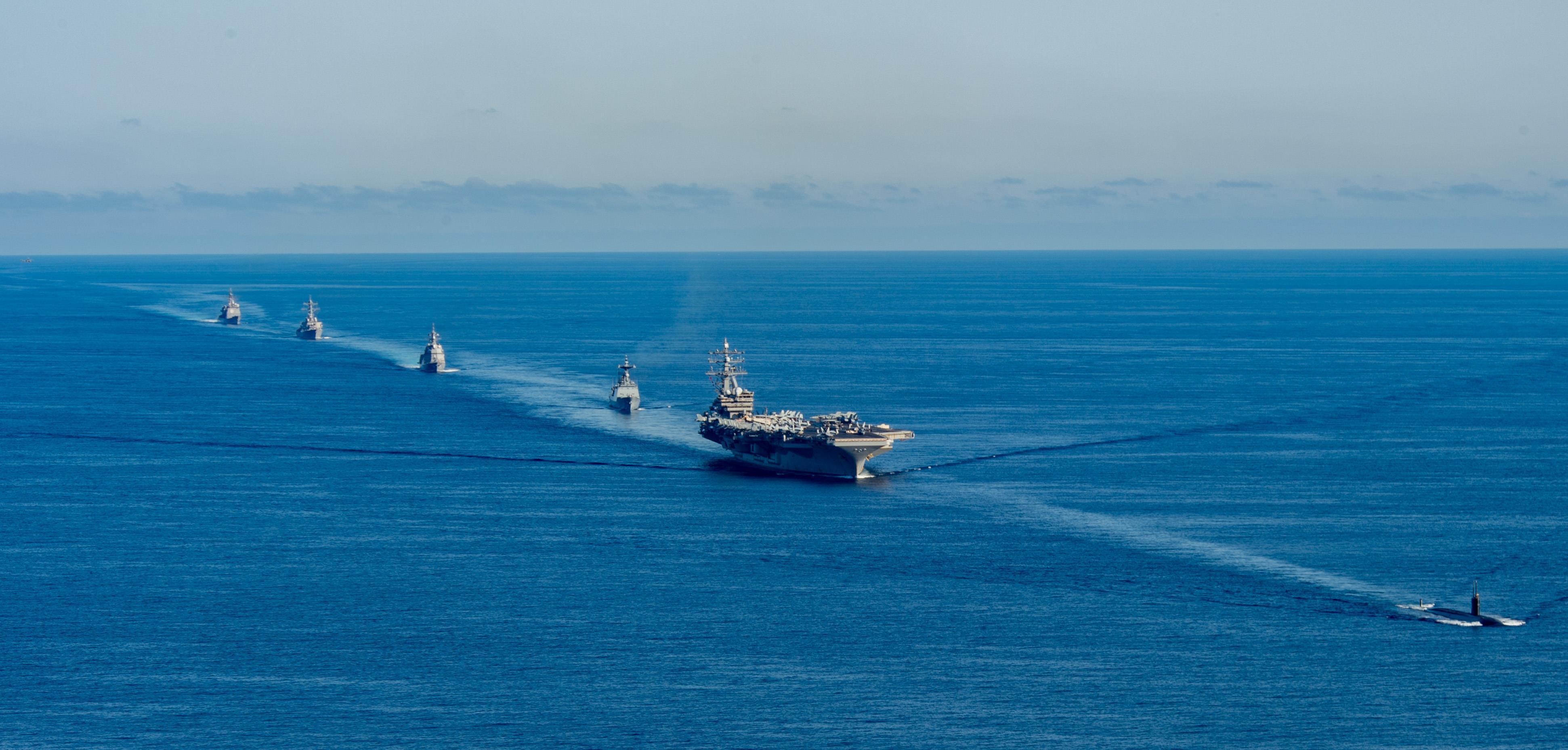 the USS Ronald Reagan aircraft carrier, second from right, participates in a joint anti-submarine drill among South Korea, the United States and Japan in waters off South Korea's eastern coast in South Korea