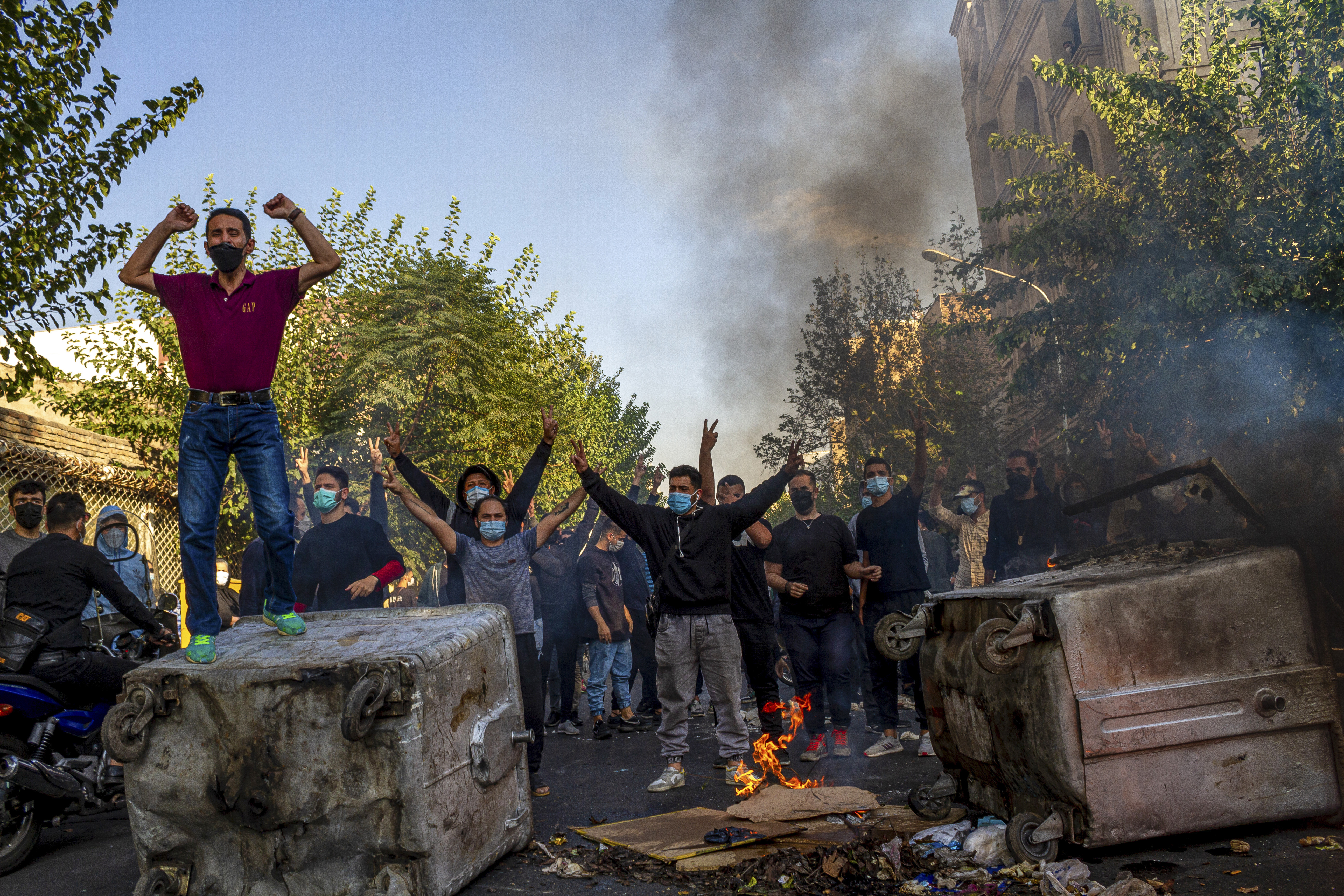Iranians protests the death of 22-year-old Mahsa Amini after she was detained by the morality police last month, in Tehran