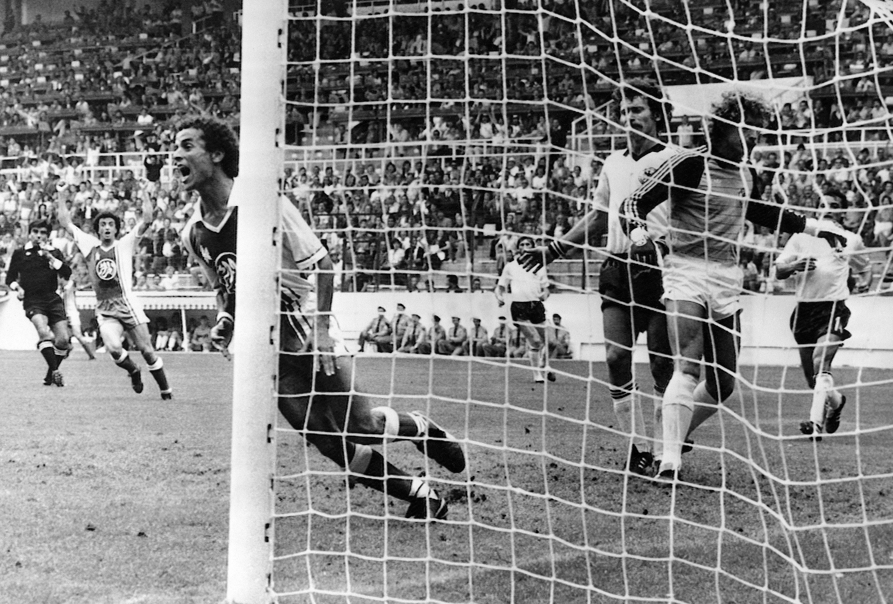 In this June 16, 1982 file photo, Algeria's Lakhdar Belloumi, left, celebrates after scoring the second and winning goal for his team during the World Cup soccer match.