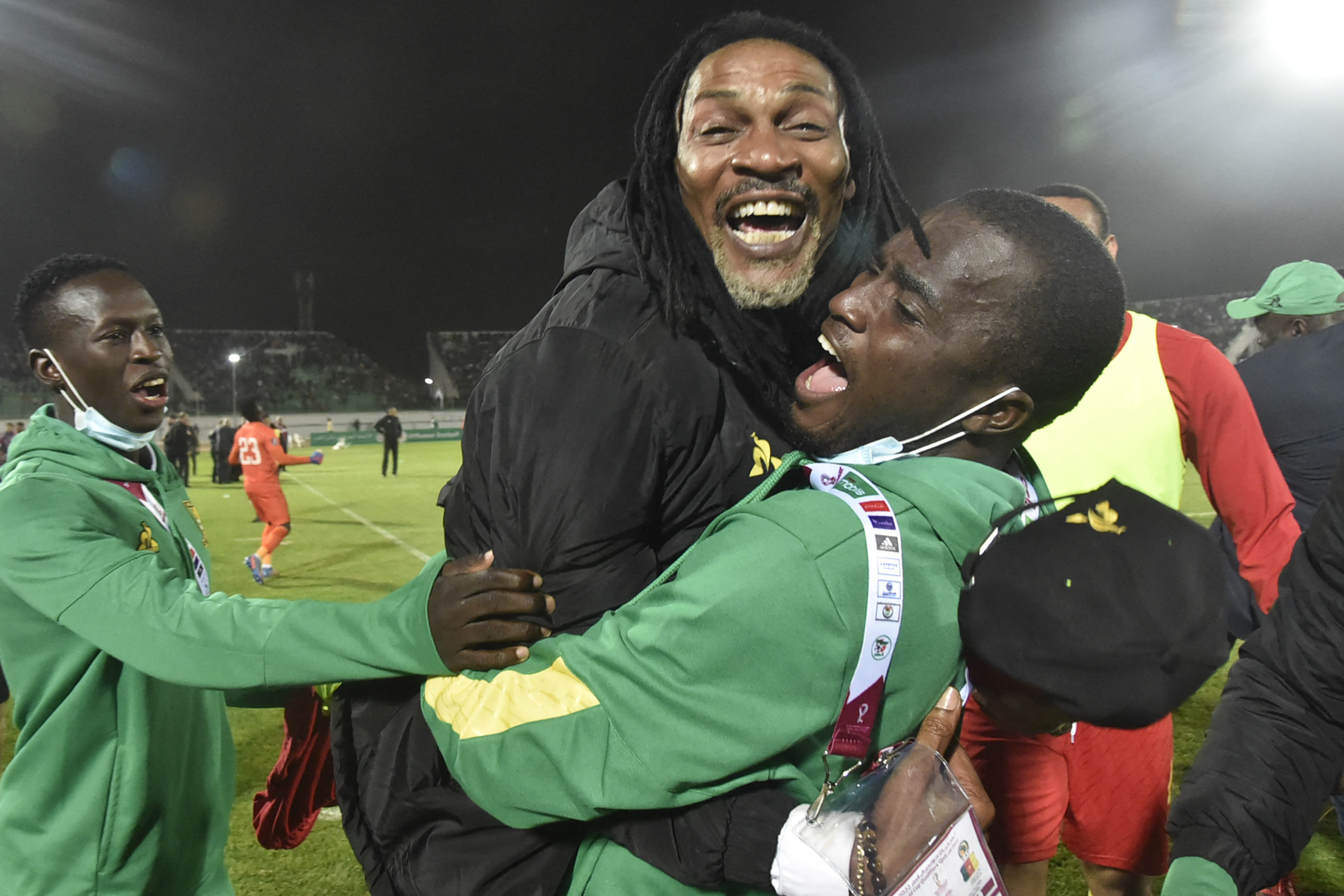 Cameroon’s coach Rigobert Song, centre, celebrates with his coaches after qualifying for the 2022 Qatar World Cup