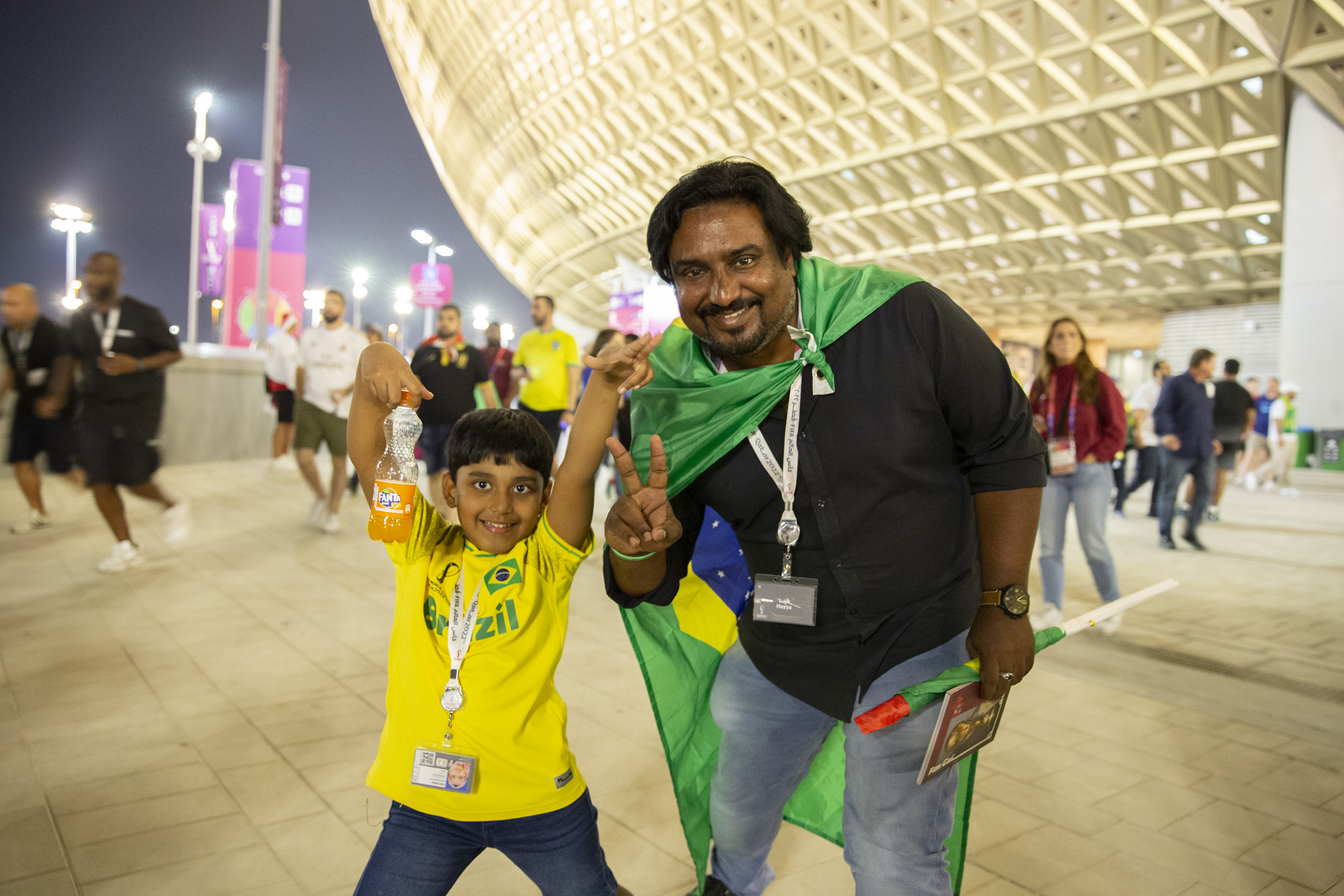 Ashiq and his son at Lusail Stadium cheering for Brazil