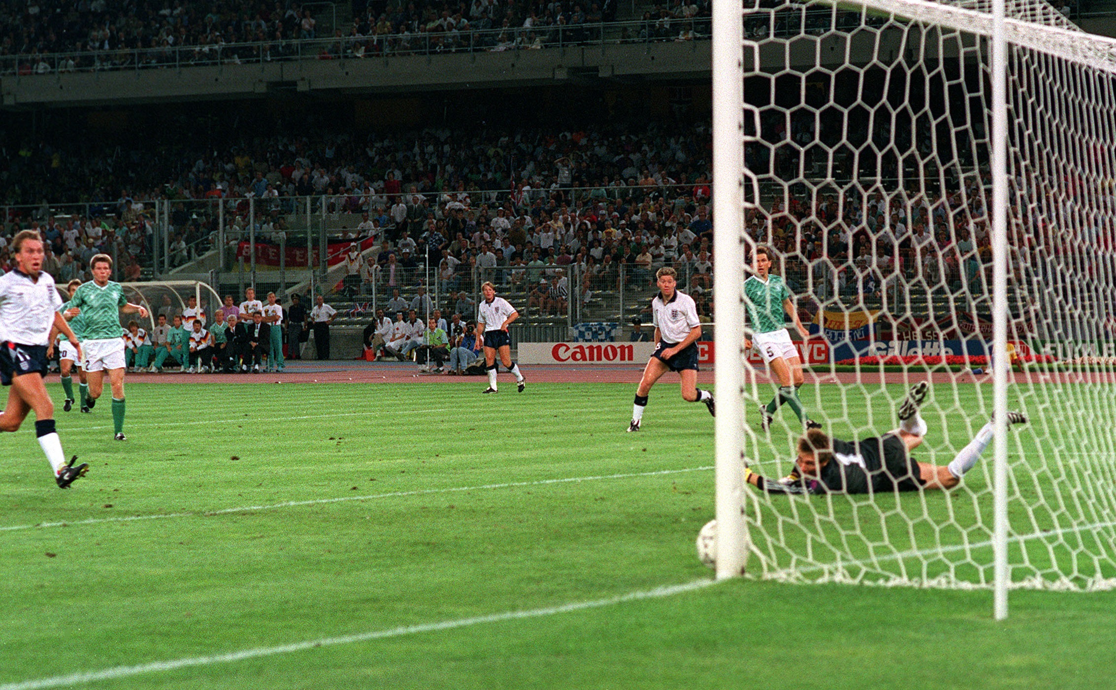 England’s Chris Waddle watches his shot beat the goalkeeper – only to hit the post
