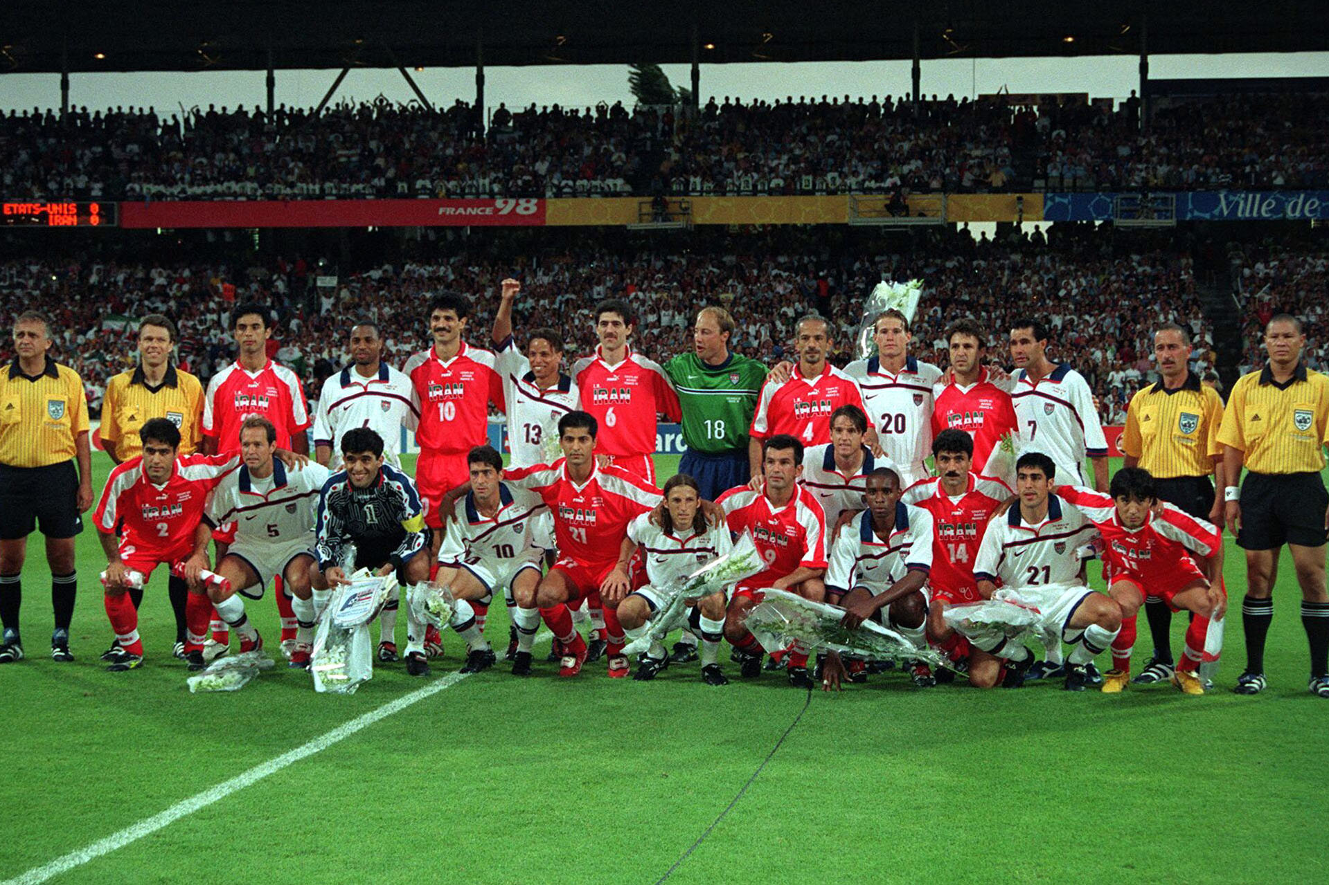 The USA and Iran teams take a photo together before their match at the 1998 World Cup in France
