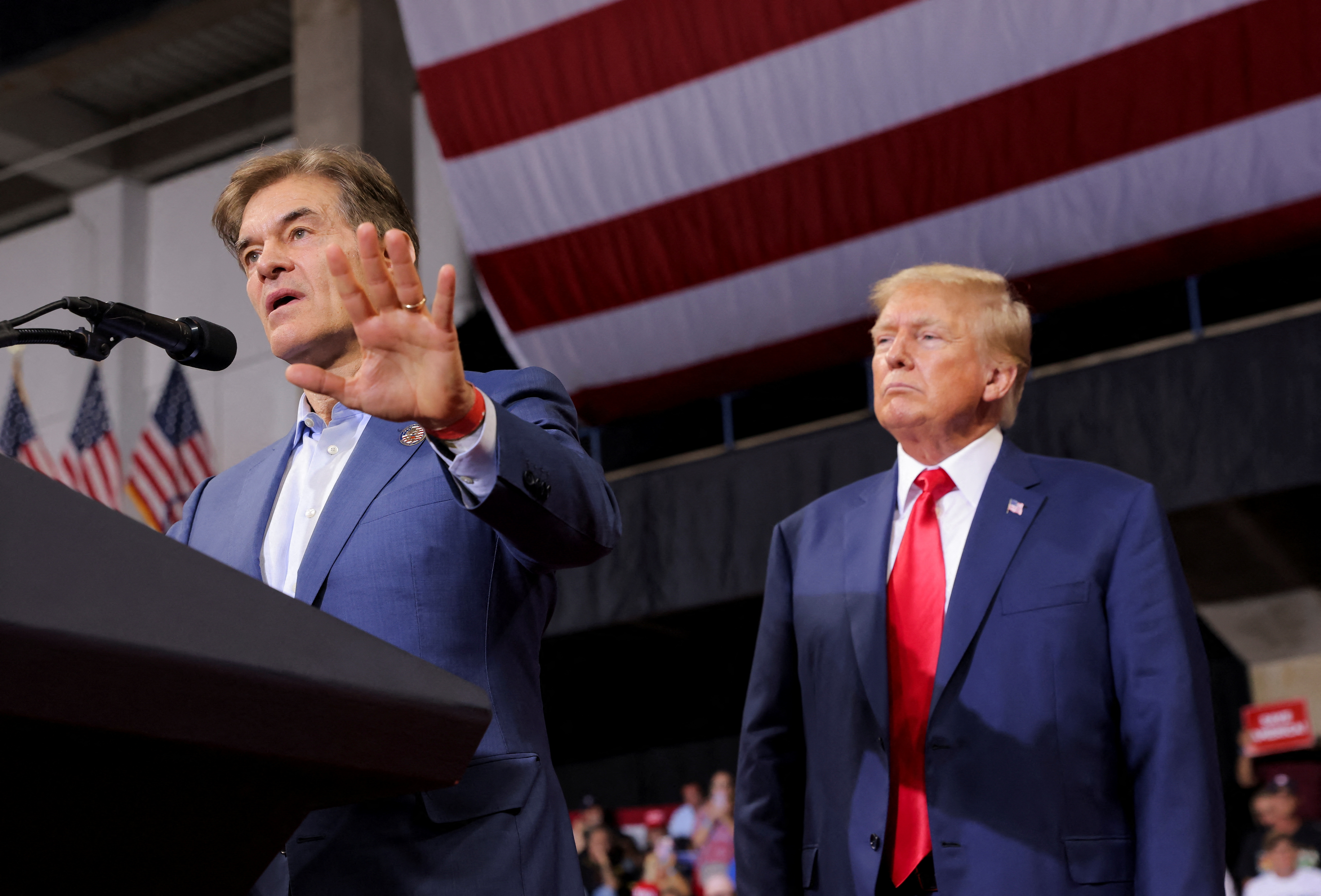 Oz speaking at Podium with Donald Trump standing behind him