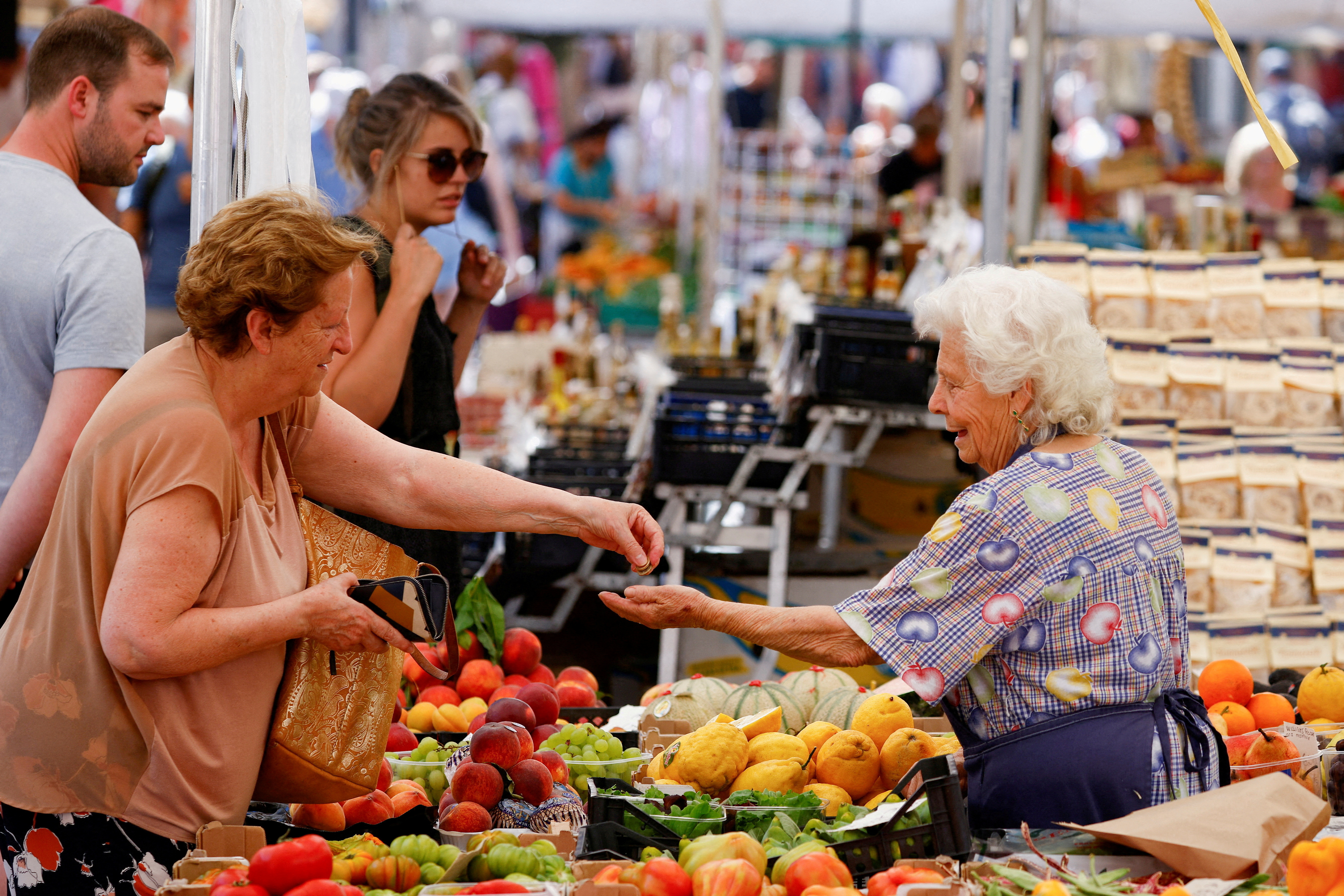 A woman shops at Campo de' Fiori market in Rome, Italy
