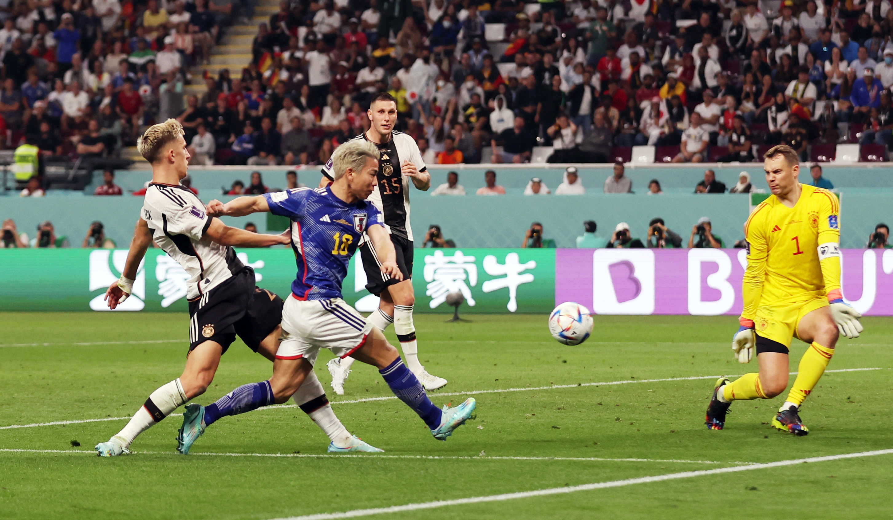 Japan’s Takuma Asano scores their second goal against Germany on November 23, 2022 in Qatar