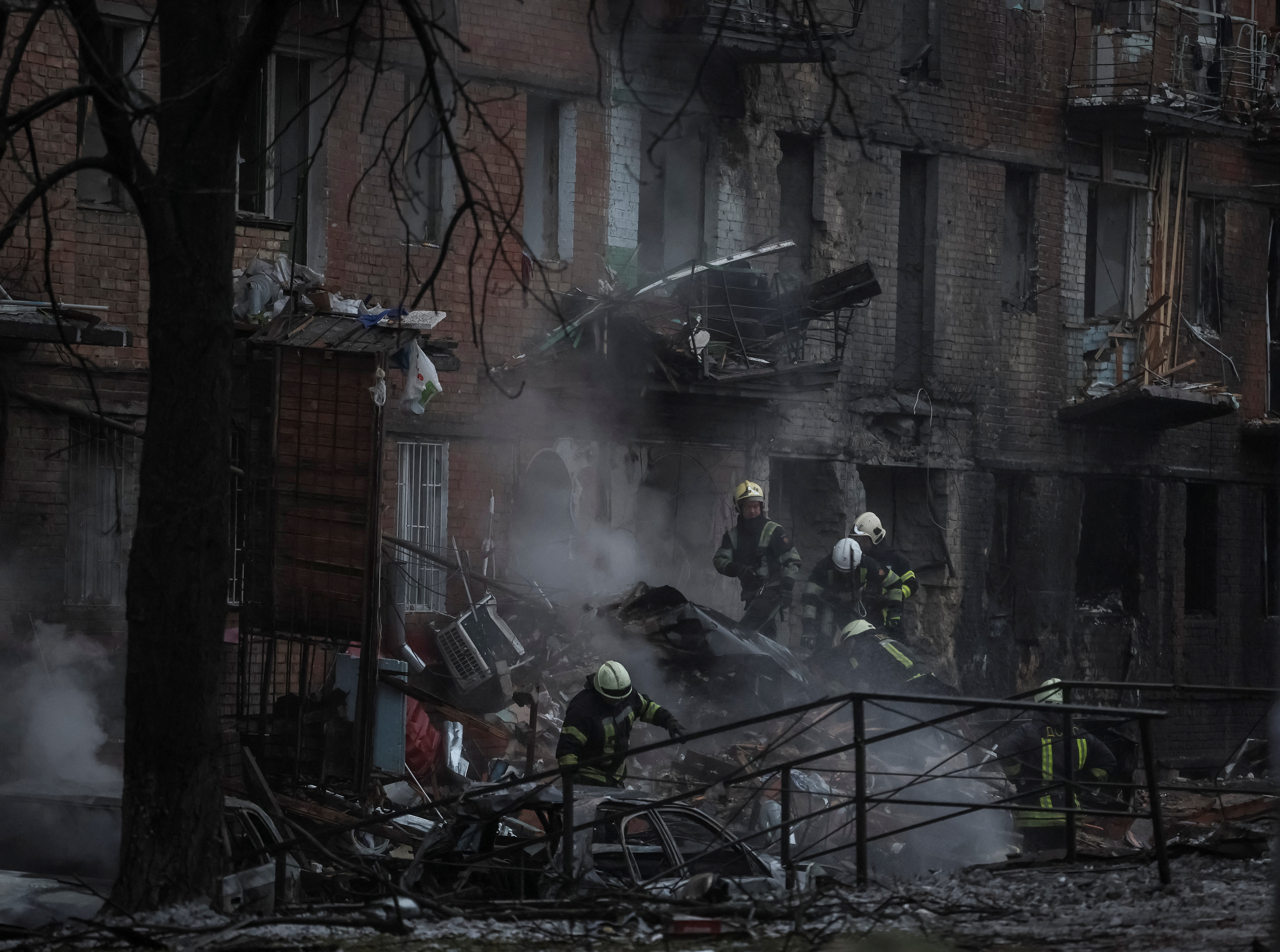 Rescuers work at a site of a residential building destroyed by a Russian missile attack, as Russia's attack on Ukraine continues, in the town of Vyshhorod, near Kyiv, Ukraine November 23, 2022. REUTERS/Gleb Garanich
