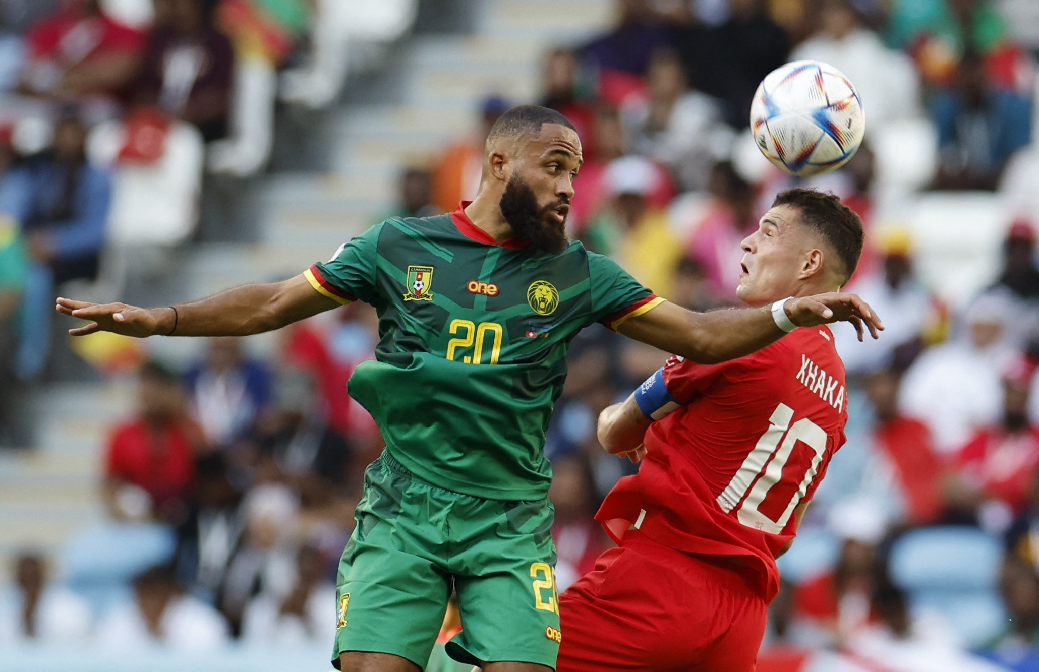 Switzerland's Granit Xhaka in action with Cameroon's Bryan Mbeumo