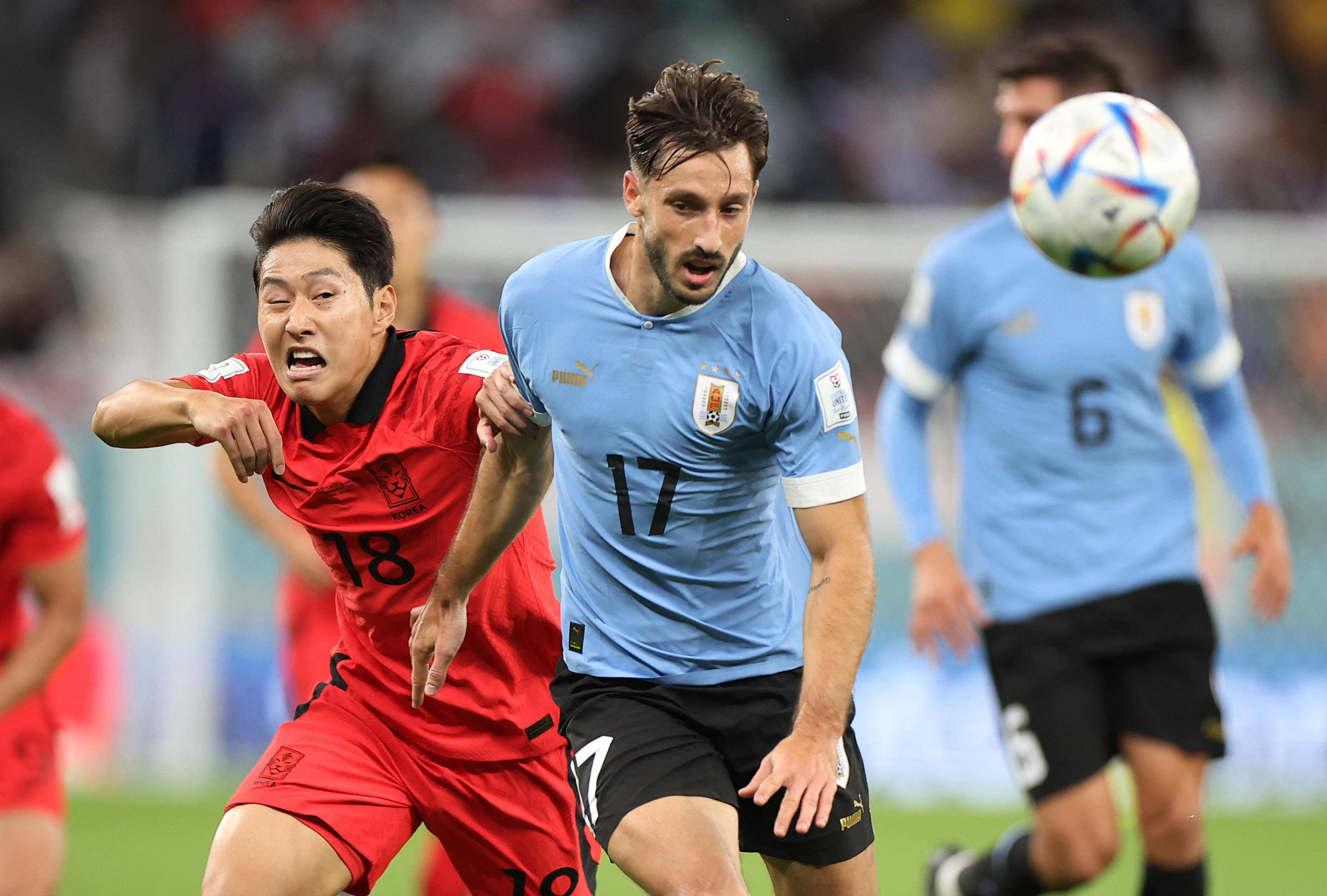 Uruguay’s Matias Vina in action with South Korea’s Lee Kang-in at the World Cup in Qatar on November 24, 2022