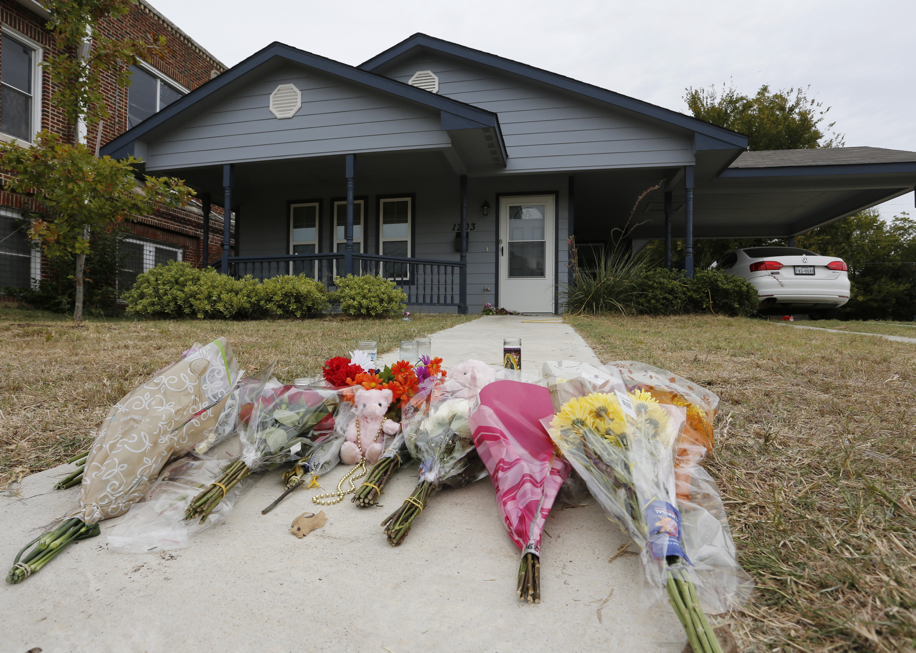 A house with flowers laid in front of it